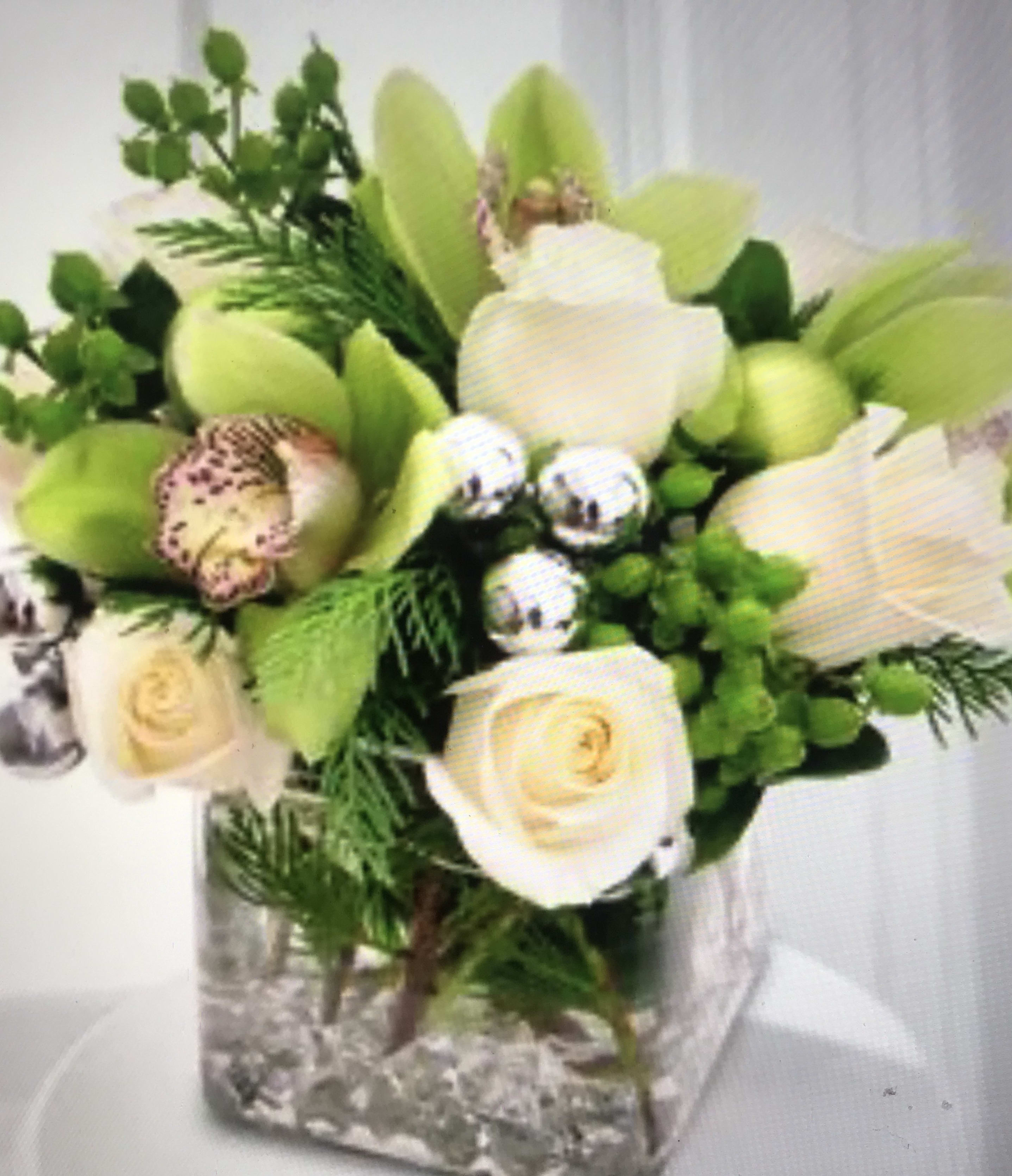 The last Holiday 2006 - glass vase with Xmas greenery, white roses ,green cymbidium. ,green  orchids and silver balls