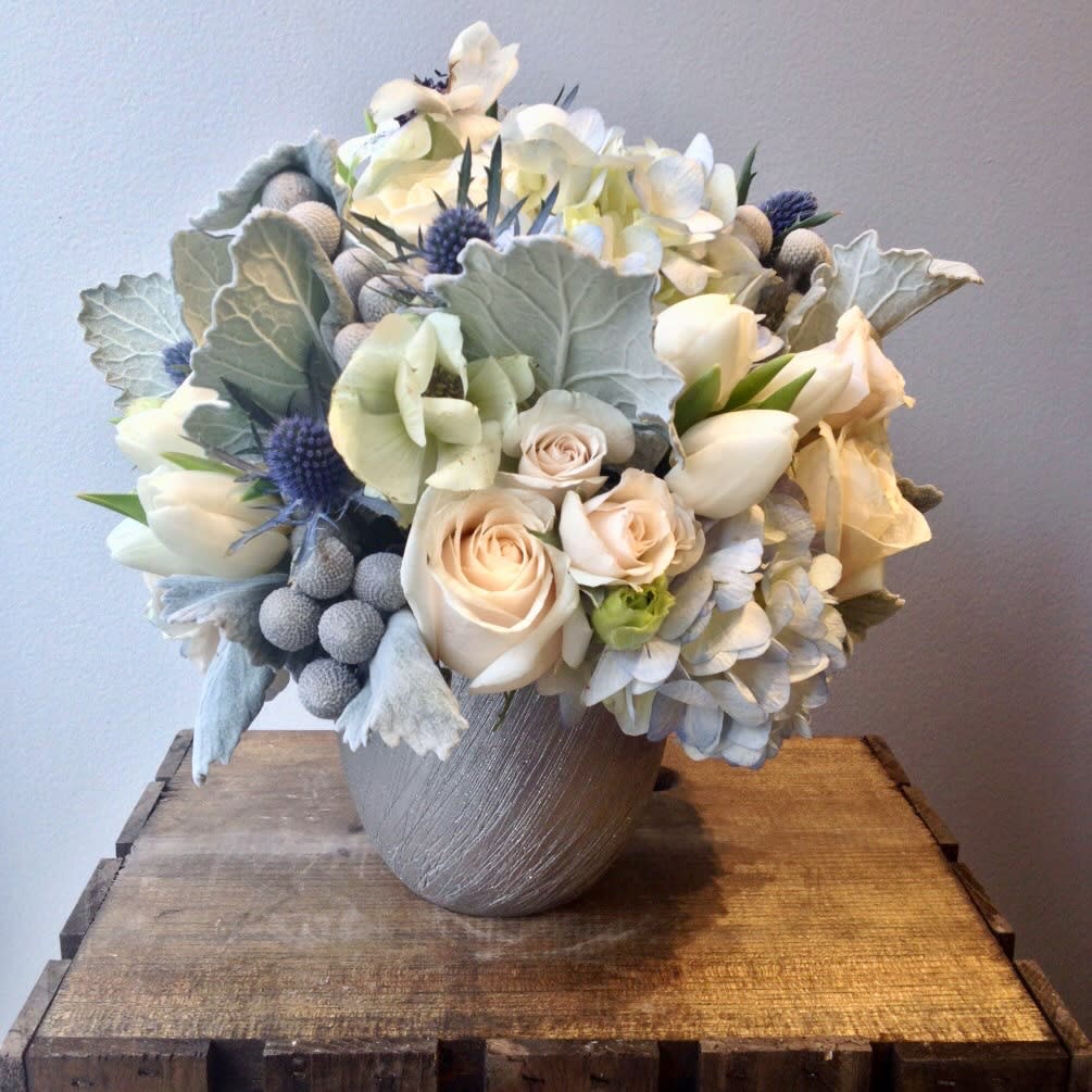 White Christmas  - In a ceramic vase winter flowers of white roses,white tulips,white hydrangeas and sea holly