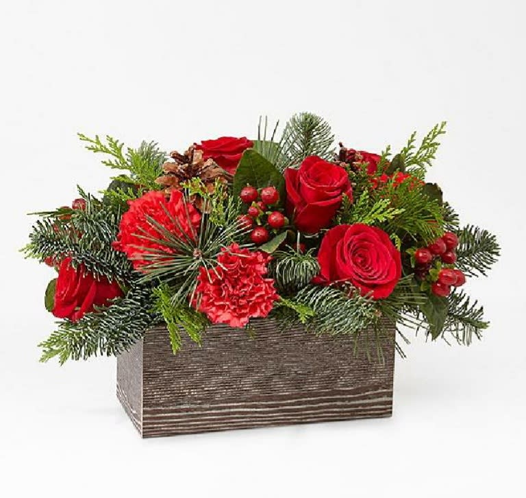 Christmas  Cabin Bouquet  - Christmas green's, carnation's rose's, pinecone's and berries in a wooden box.