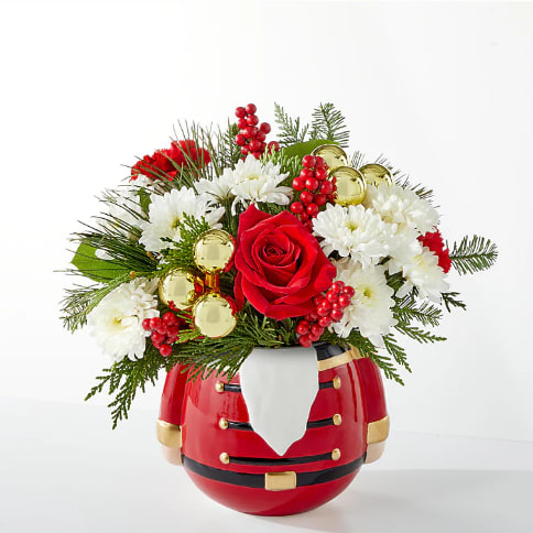 Merry Magic Bouquet - Share in the nostalgia of the season with a collectable nutcracker vase perfectly accented with holiday blooms.