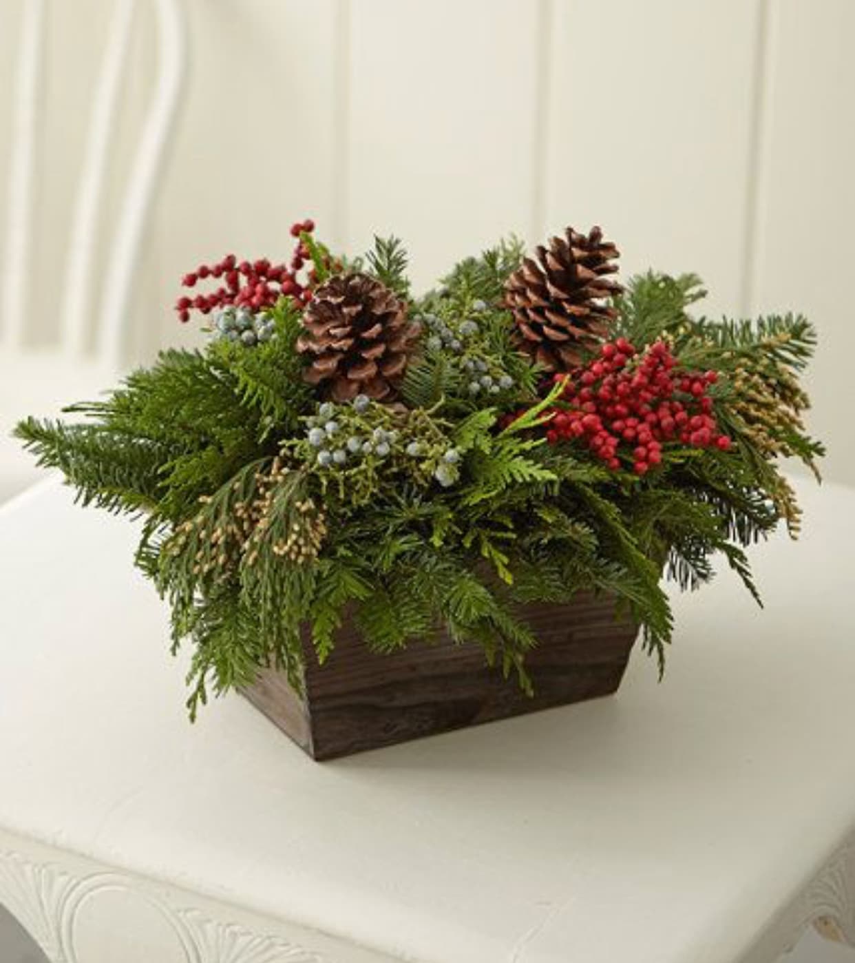 Rustic Holiday - This Wooden Box is filled and overflowing with the best Christmas Greens available  Pine cones and red berries round out this holiday treasure 
