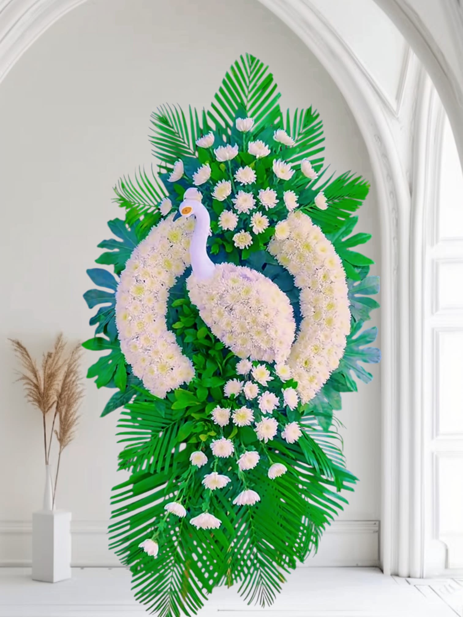 White Swan Standing Sympathy Flowers Arrangement - This elegant standing arrangement features a graceful white swan crafted from fresh white blooms, symbolizing purity, peace, and eternal love. Surrounded by lush green foliage, it provides a serene and heartfelt tribute for memorials, funerals, and celebration-of-life ceremonies