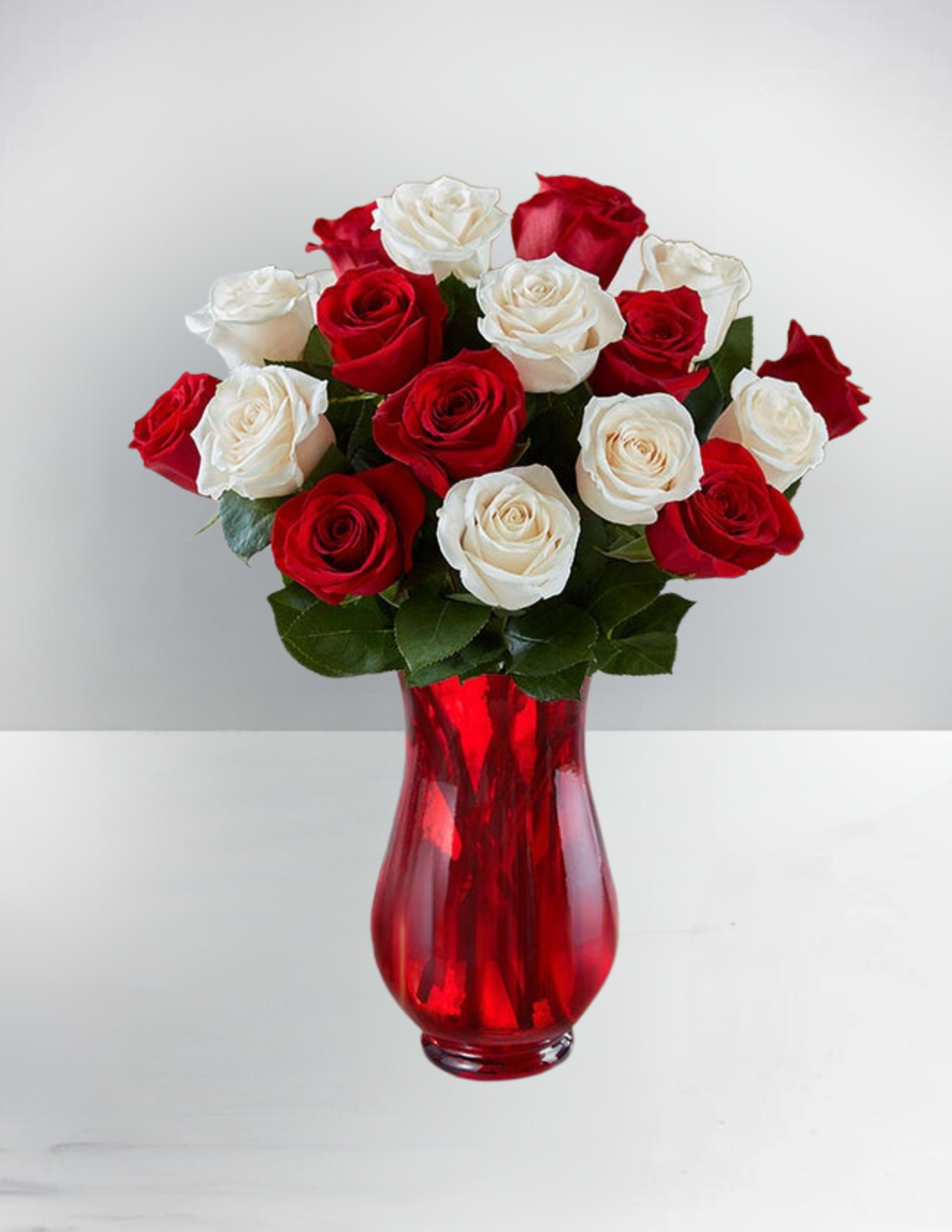 Peppermint roses - Capture the spirit of the season with our fresh peppermint rose bouquet. Inspired by the classic pinwheel candy, our festive red and white blooms come in gatherings of 18 stems. It’s a special holiday treat that’s sure to warm the hearts of family &amp; friends.
