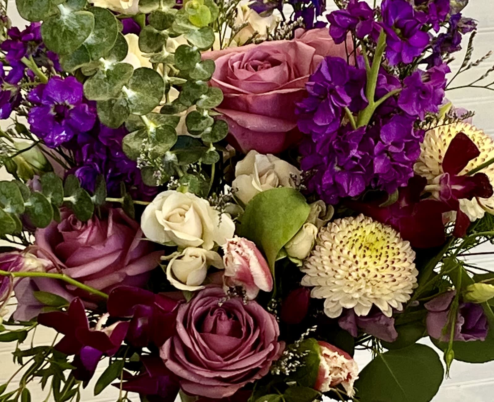 Shades of Purple Bouquet - This is a beautiful assortment of purple flowers. This is a wrapped bouquet and does not include a vase.