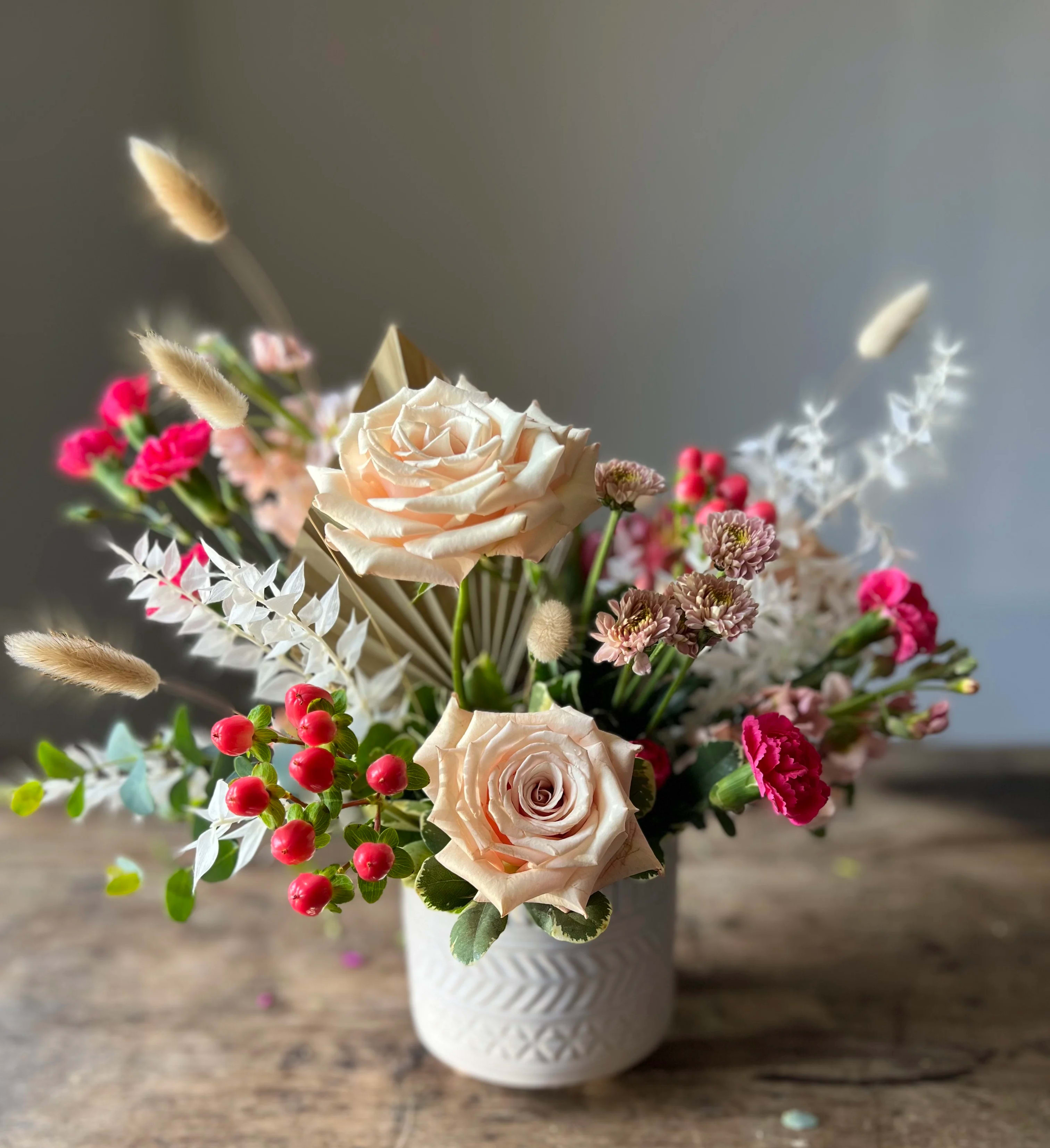 Boho Bloom Pot - This arrangement is sweet and contemporary and perfect for any occasion. Welcome baby, BFF sentiments, or any loving occasion.  Roses, pixies, and dried flowers in a ceramic pot.