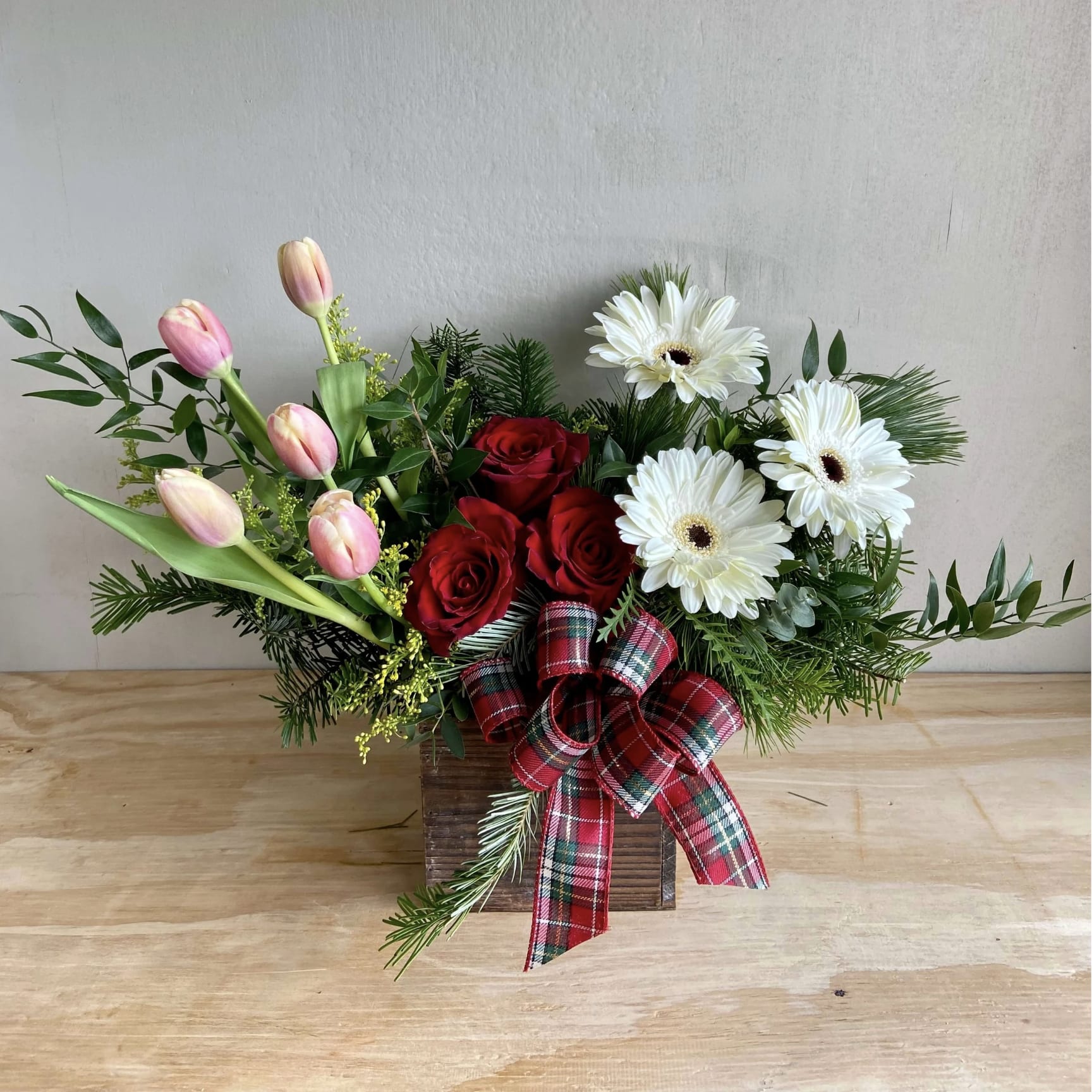 Christmas Ties  - Flowers warmly express your feelings of love and appreciation. Send your hostess or special loved ones this gorgeous Christmas piece featuring the warmth of sunflowers, the charm of Please note that every design is custom made and substitutions to container and flower types may happen from time to time. Design aspects will always stay the same, but if needed, we will substitute with flowers of equal or greater value to offer you a great floral shopping experience! Our flowers are 100% guaranteed. Please call us with any questions or concerns.