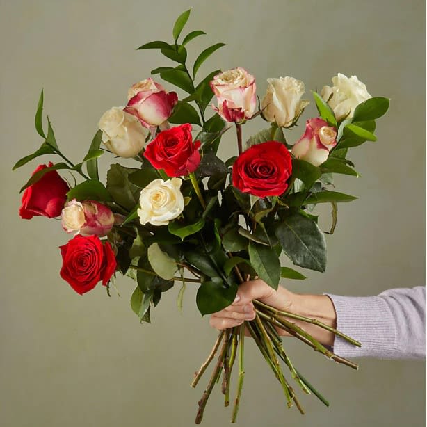 Santa Baby Rose Bouquet - These precious baby roses in classic holiday colors are just the thing to make their home more merry – or yours.  Please Note:The bouquet pictured reflects our original design for this product. While we always try to follow the color palette, we may replace stems to deliver the freshest bouquet possible.