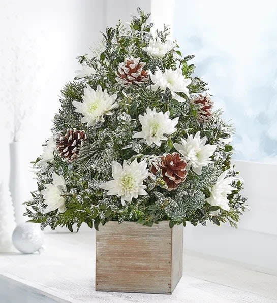 Christmas Enchantment Holiday Flower Tree - Holiday Flower Tree has been redesigned, finding the magic of Christmas holidays. Beautifully arranged with white flowers, greenery, pinecones and more, designed in our natural wooden cube planter to add more love and warmth.