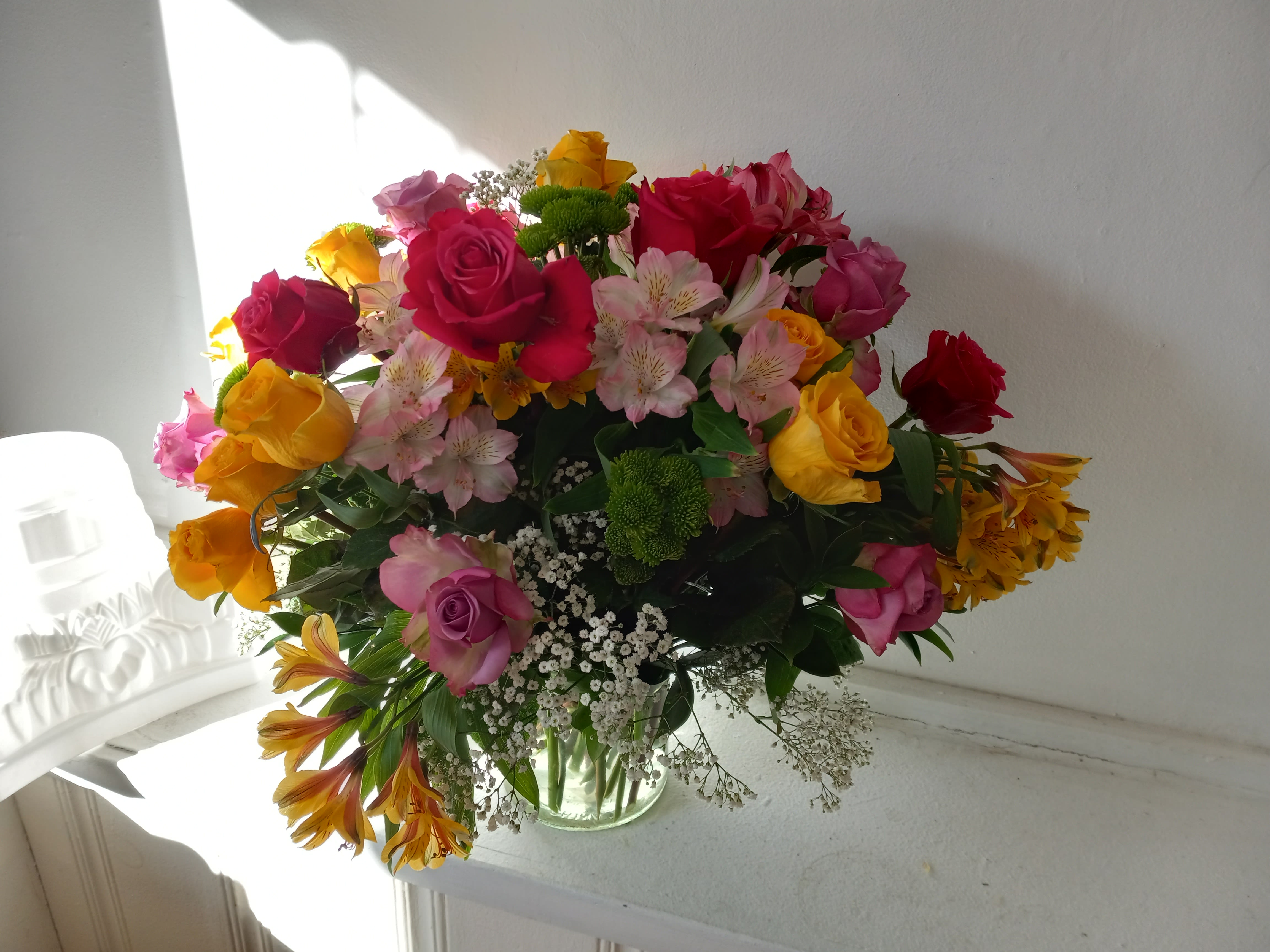  Mix color roses with assorted alstroemeria (Peruvian lily) and baby's breath in a vase  - Colorful mixed colors roses in a vase with Alstroemeria, baby's breath and greens added