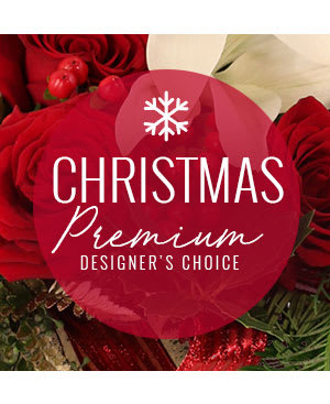 Premium Christmas Blooms - We arrange premium holiday greens and blooms. Our professional and talented florist will create a beautiful centerpiece for you or your loved one! Please specify if you'd prefer a tall or short container in the special instructions. 