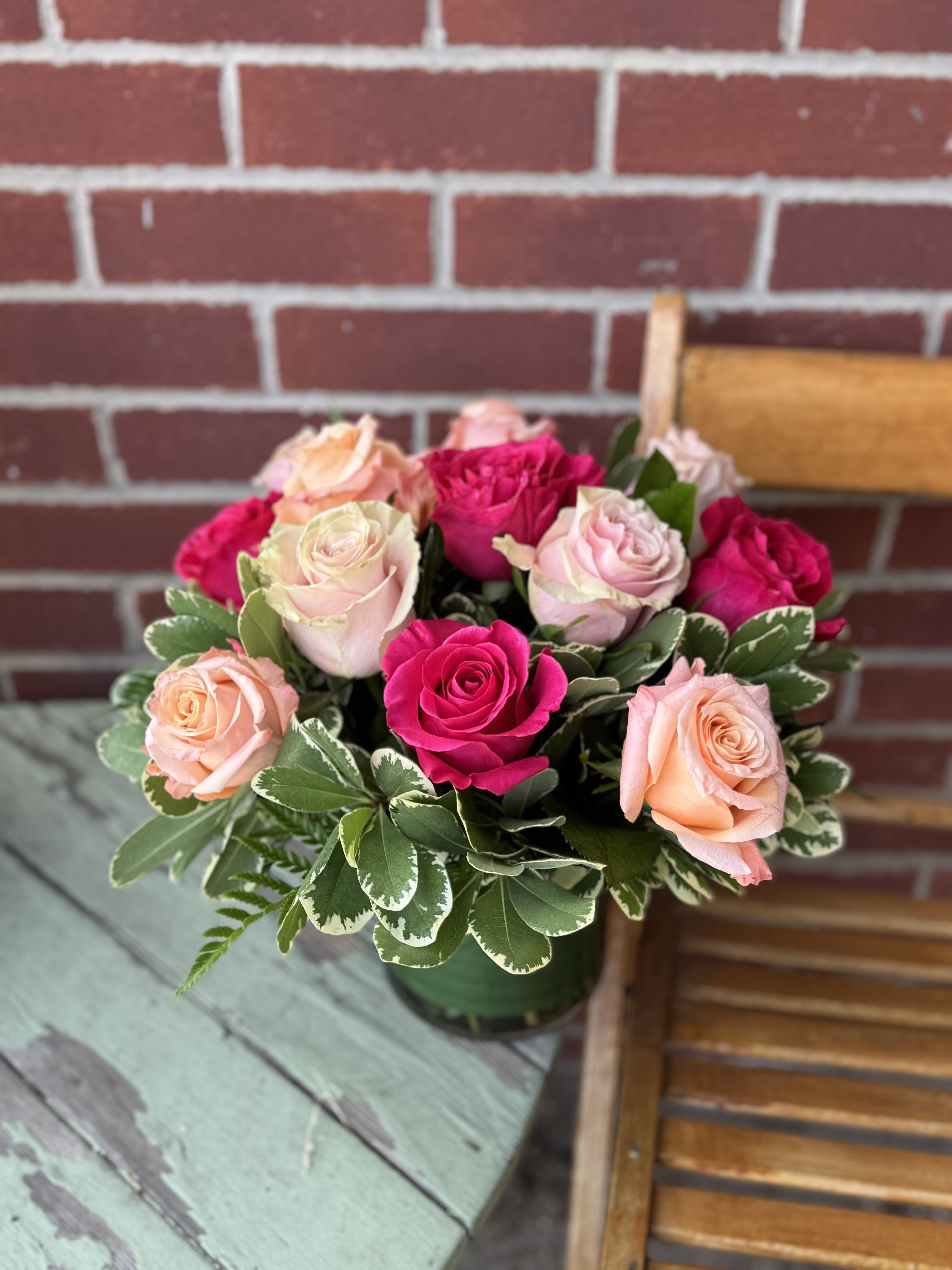 Scootaloo Rose Bouq *NEW ITEM* - One dozen roses in shades of light pink, peach and hot pink designed in a low vase with foliage. 