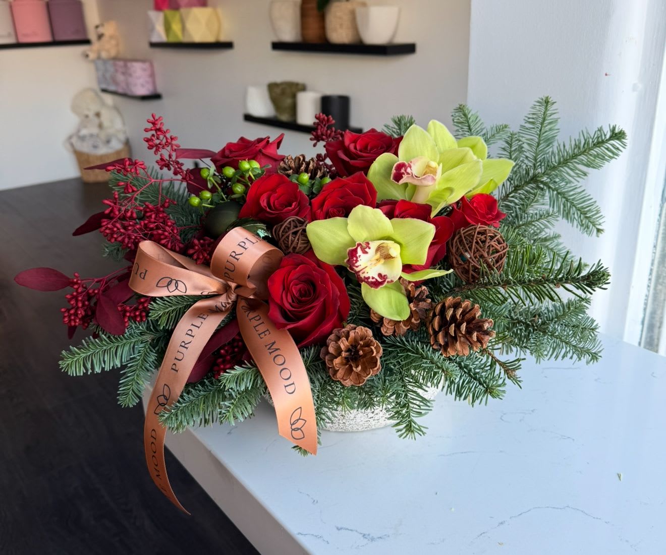 Classic Christmas Centerpiece  - Round vase with red roses and decor 