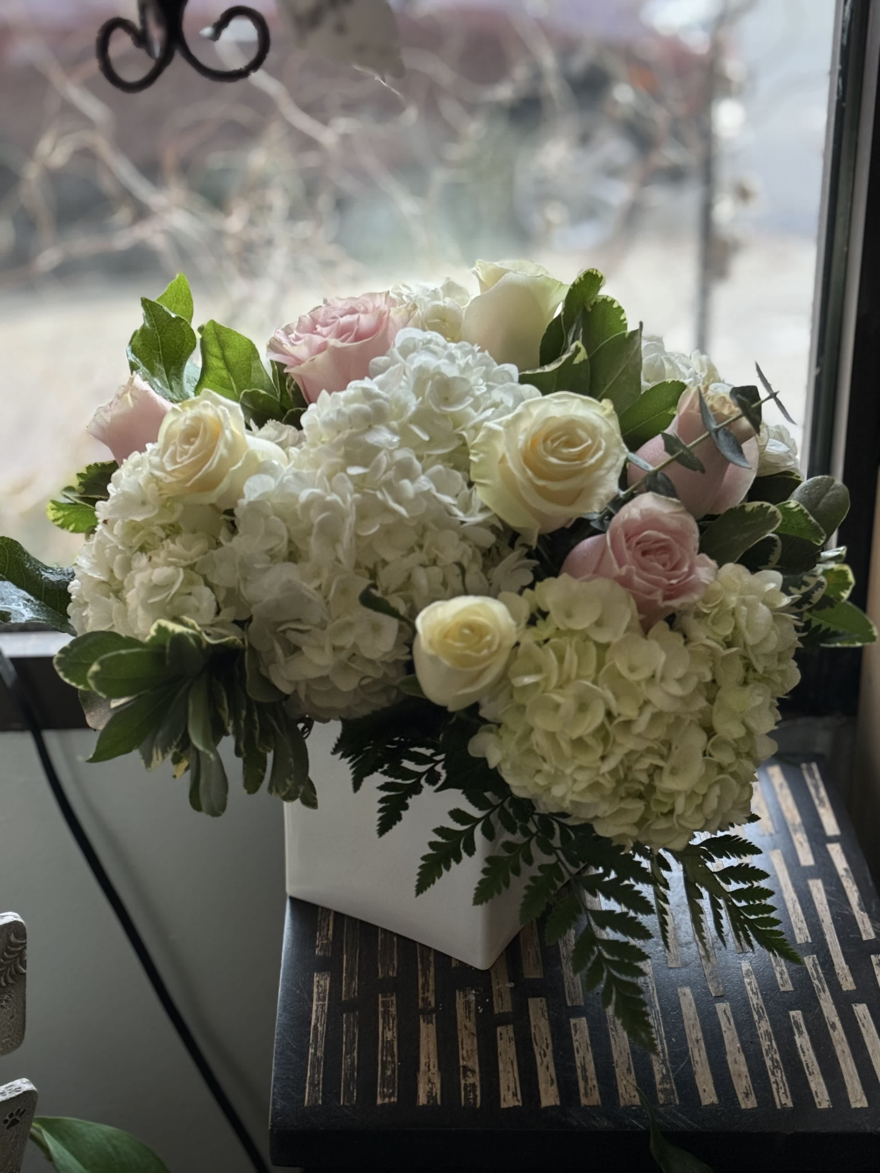 Luck be a Lady  - A beautiful arrangement of hydrangeas, pink and creamy roses arranged. This soft and delicate bouquet is perfect for any occasion. 