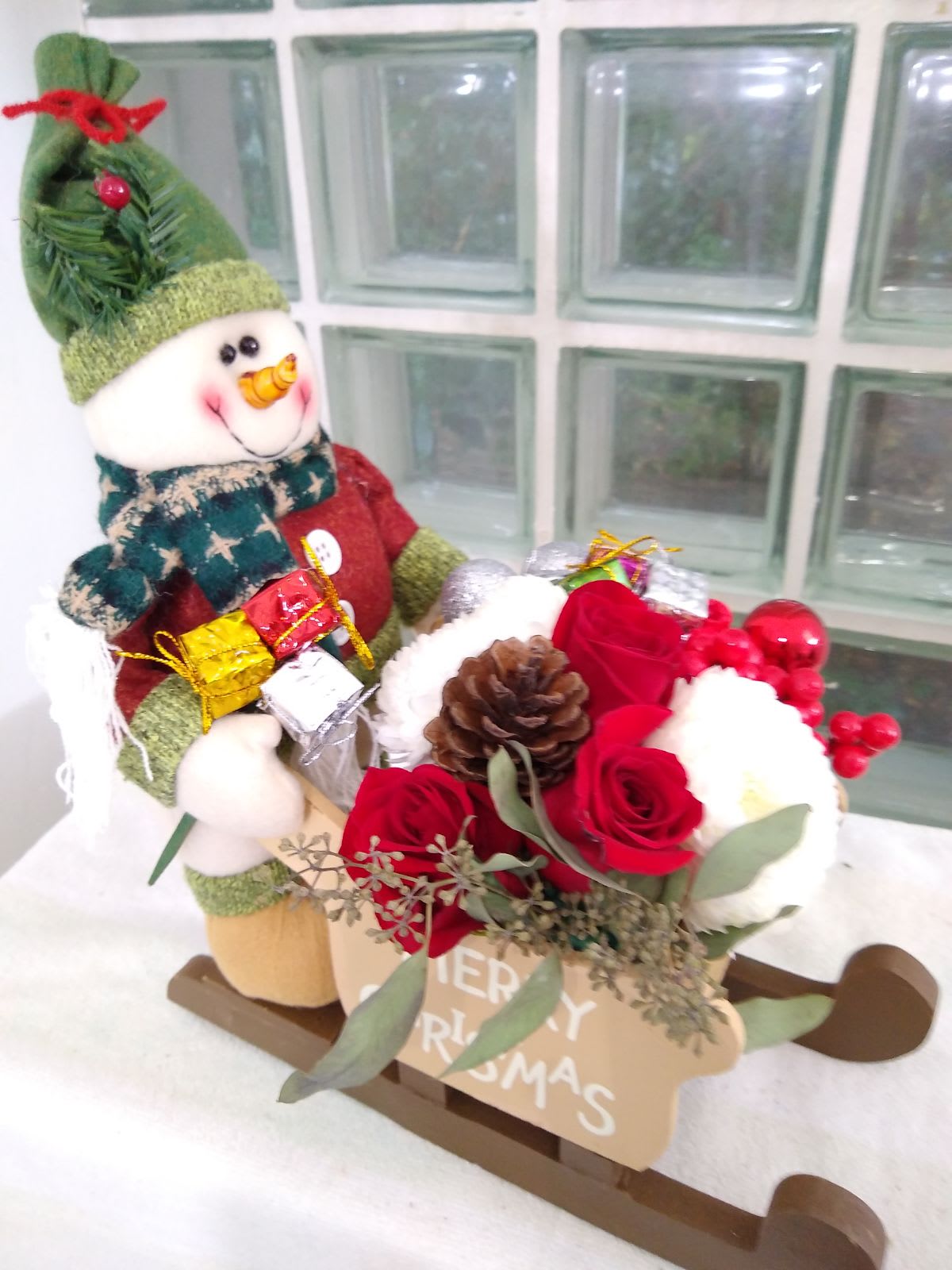 Sleighs Away - This sleigh has a cute driver that will direct this gift into your special recipient's heart.