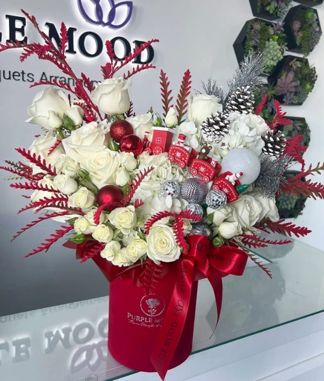 Christmas train box - "Red velvet box with roses, greens and Christmas decor Standard size same as pictured. Container size D6.75’x H7.5′ Front side arrangement with lid in back. Box included wet floral foam inside, box doesn’t require vase."