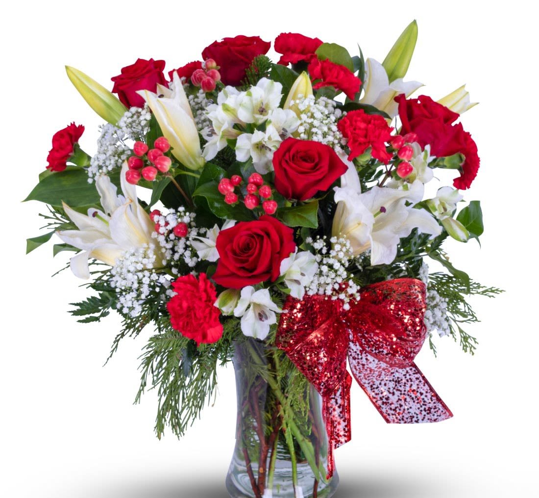 Gulfport Floral Celebration  - Share the Joy of the Christmas Season to the those you love with the beautifully traditional holiday bouquet! Sure to please with its long lasting evergreens and Christmas trimmings!    (Flowers types may vary depending on availability)