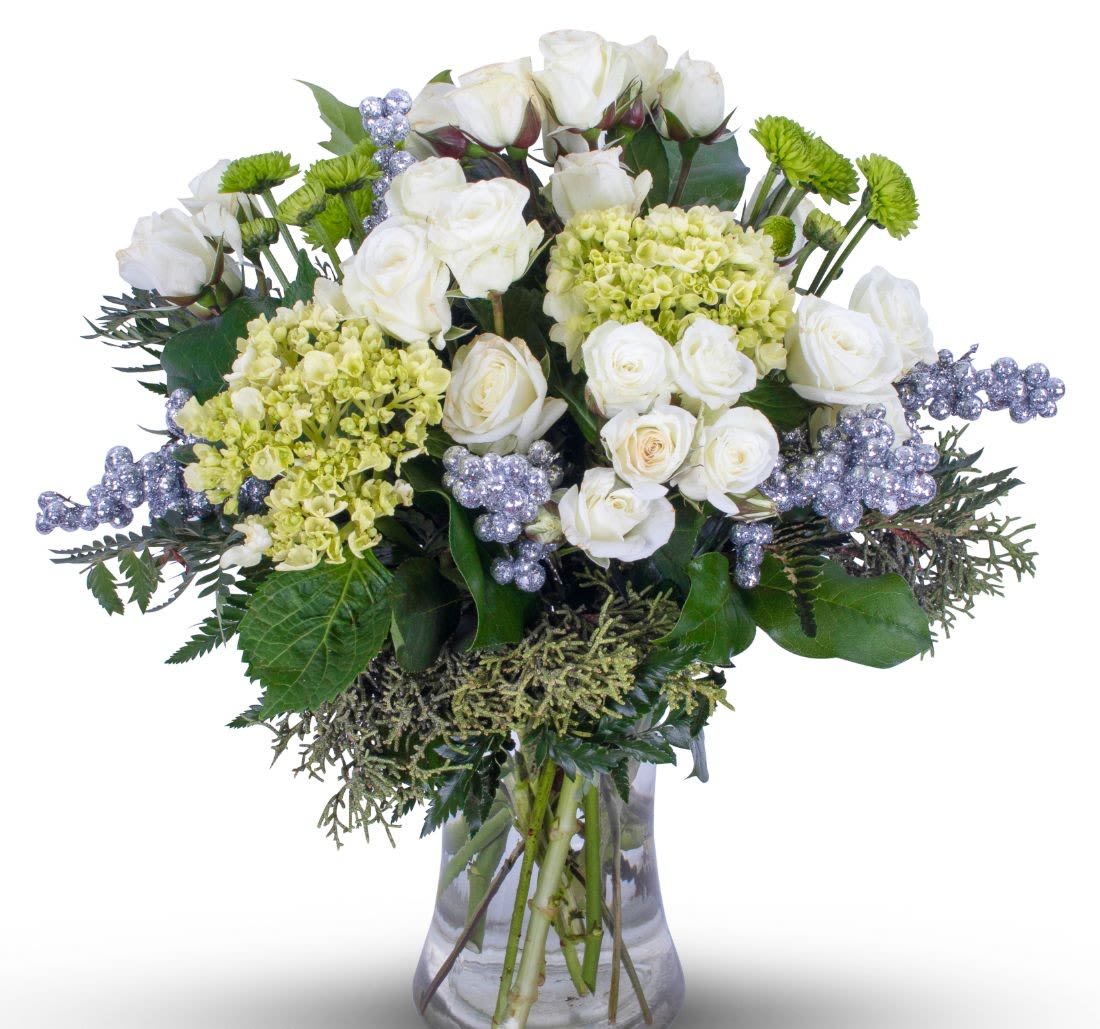 Happy Holidays  - Share the Joy of the Christmas Season to the those you love with the beautifully traditional holiday bouquet! Sure to please with its long lasting evergreens and Christmas trimmings!    (Flowers types may vary depending on availability)