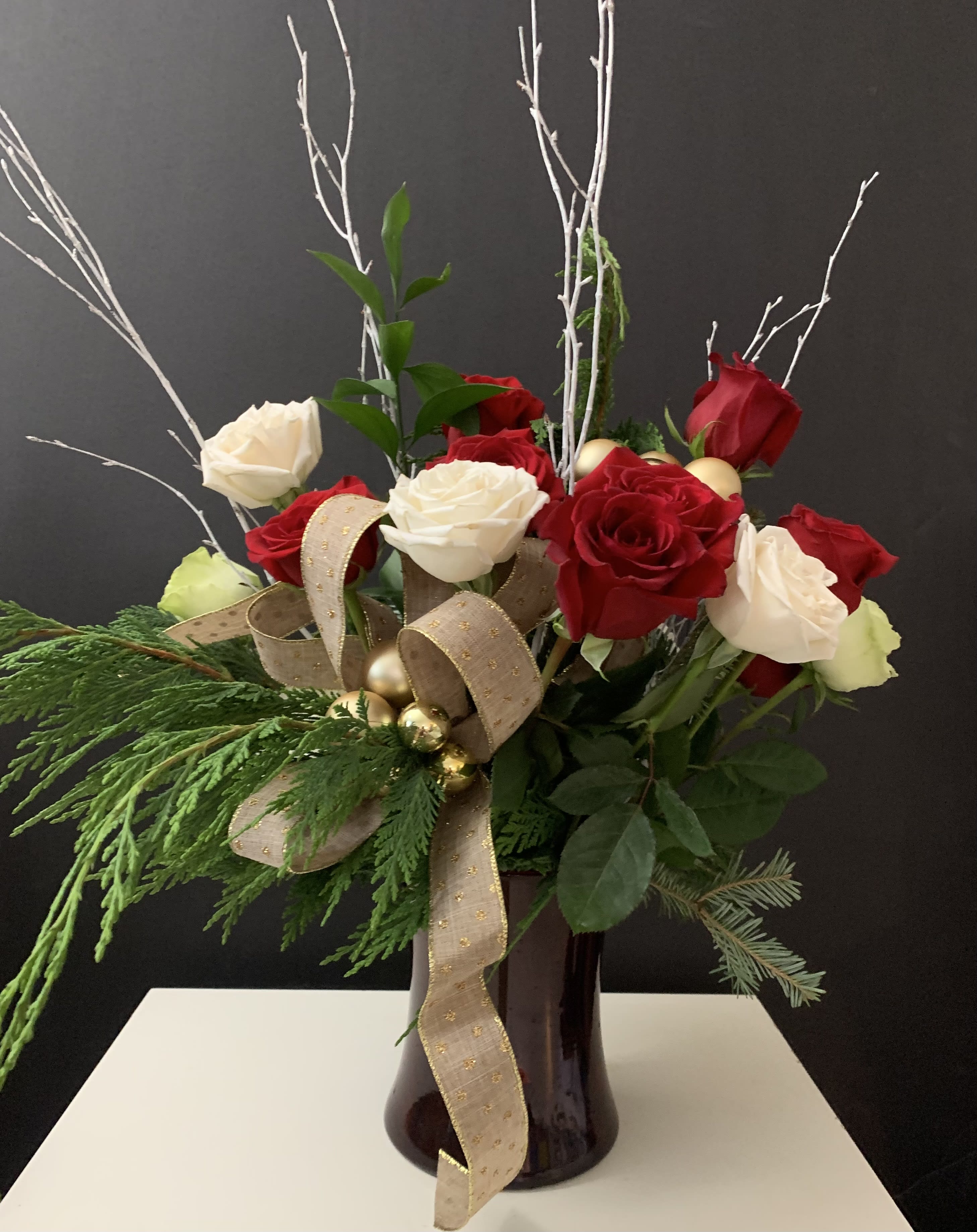 Christmas Day  - Roses and green in glass vase 