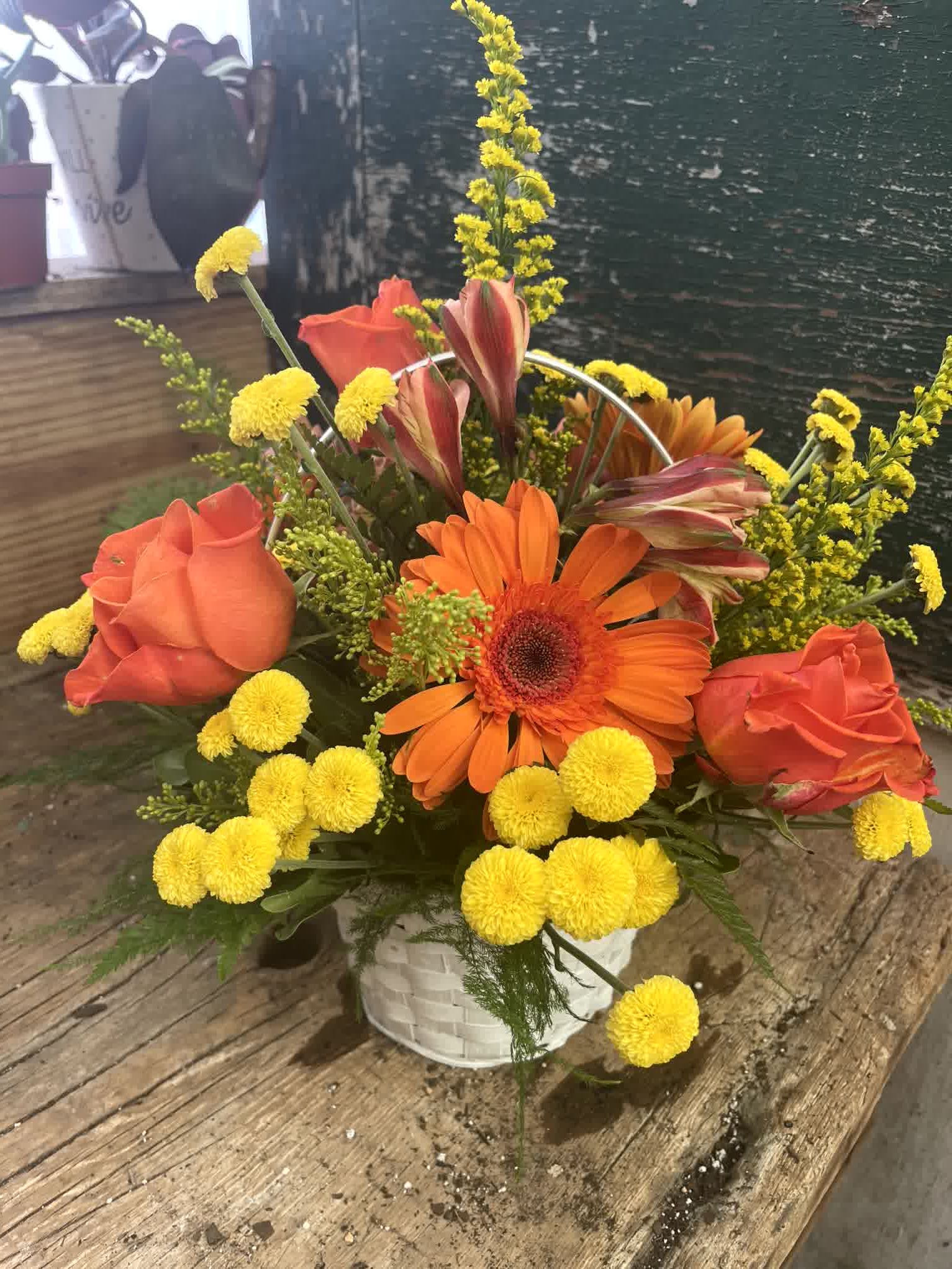 Sunshine Surprise - Everyone's emotions will rise and shine with this bright, delightful basket of roses, alstroemeria, pompons and more!