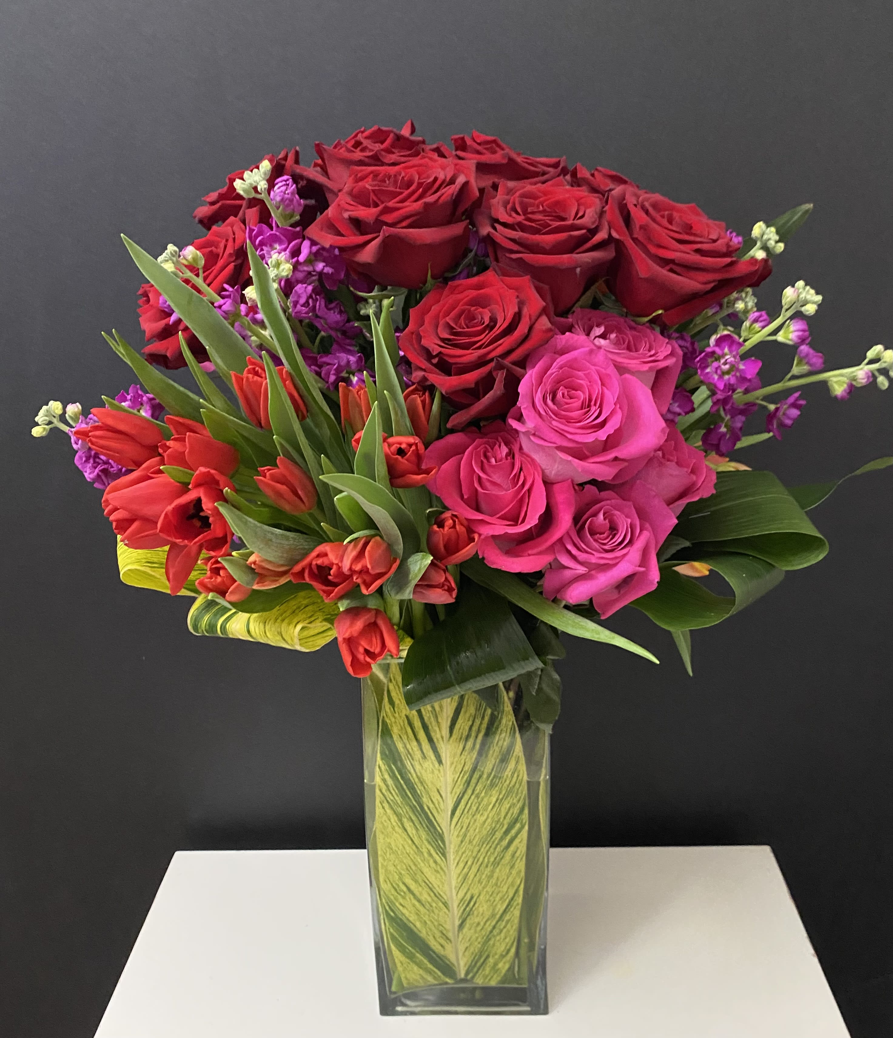 Dance with me  - Roses and green in tall glass vase 