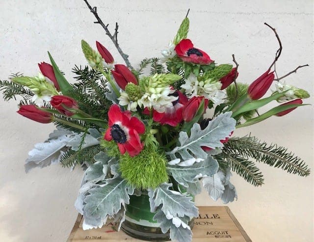 Christmas Anticipation  - Red Tulips , Anemones , green in 6&quot;x6&quot; cylinder glass vase 