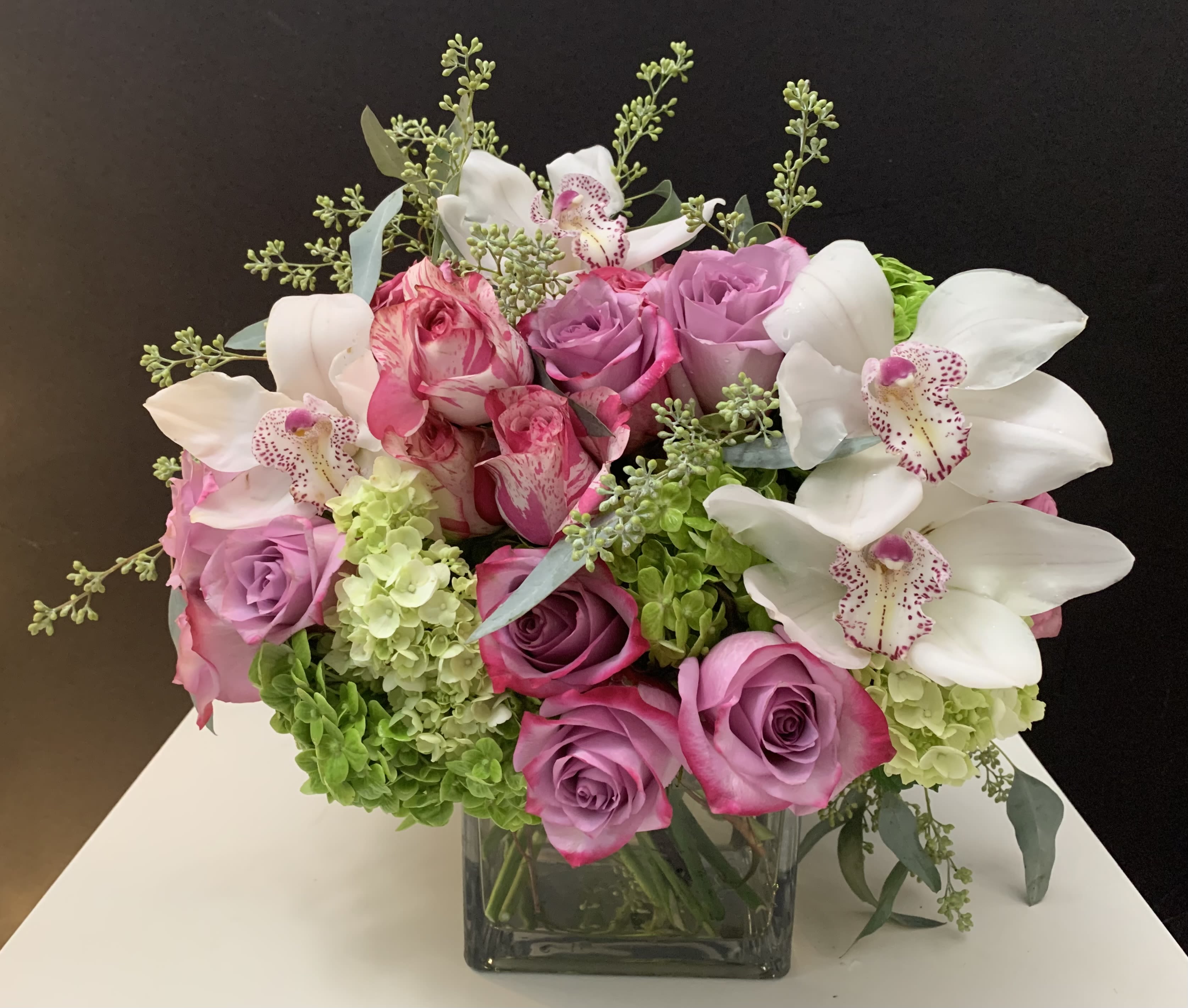 Pacific view  - Roses, Hydrangeas, Orchid blooms in 6x6 square glass vase 