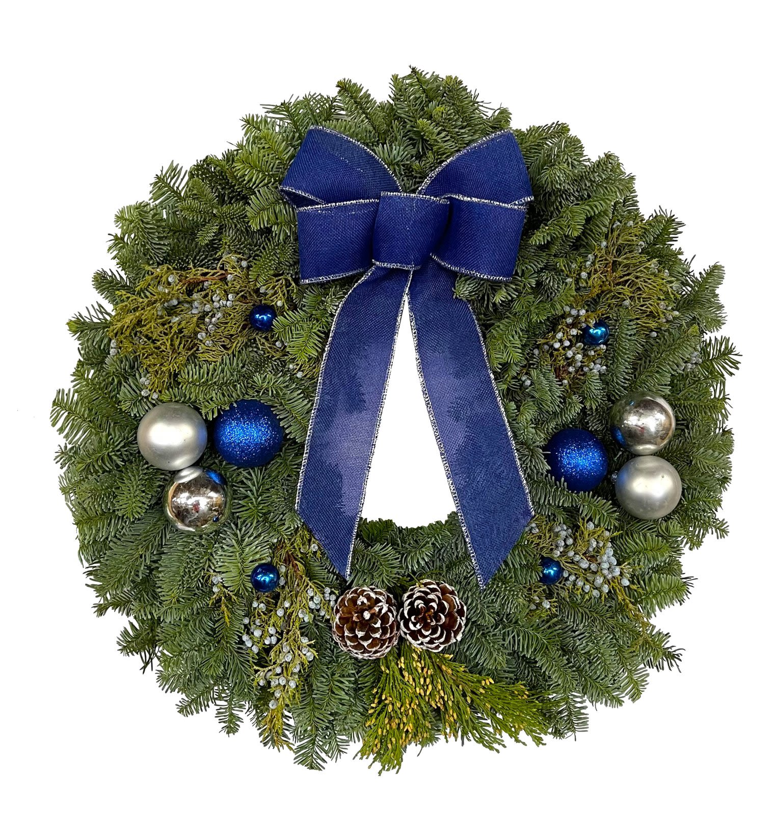 24 inch live moonlight wreath  - This delicate assortment of ball ornaments, white painted cones, Royal Blue burlap bow and Noble Fir, Berried Juniper accented with Western Red Cedar is indeed festive. As with all our wreaths, they are hand tied and specially treated. Beautifully made.  24&amp;quot; Overall.   All Christmas wreaths are pre-dipped for extended shelf life.    This hand-made product makes a great gift and may differ slightly from the picture shown.