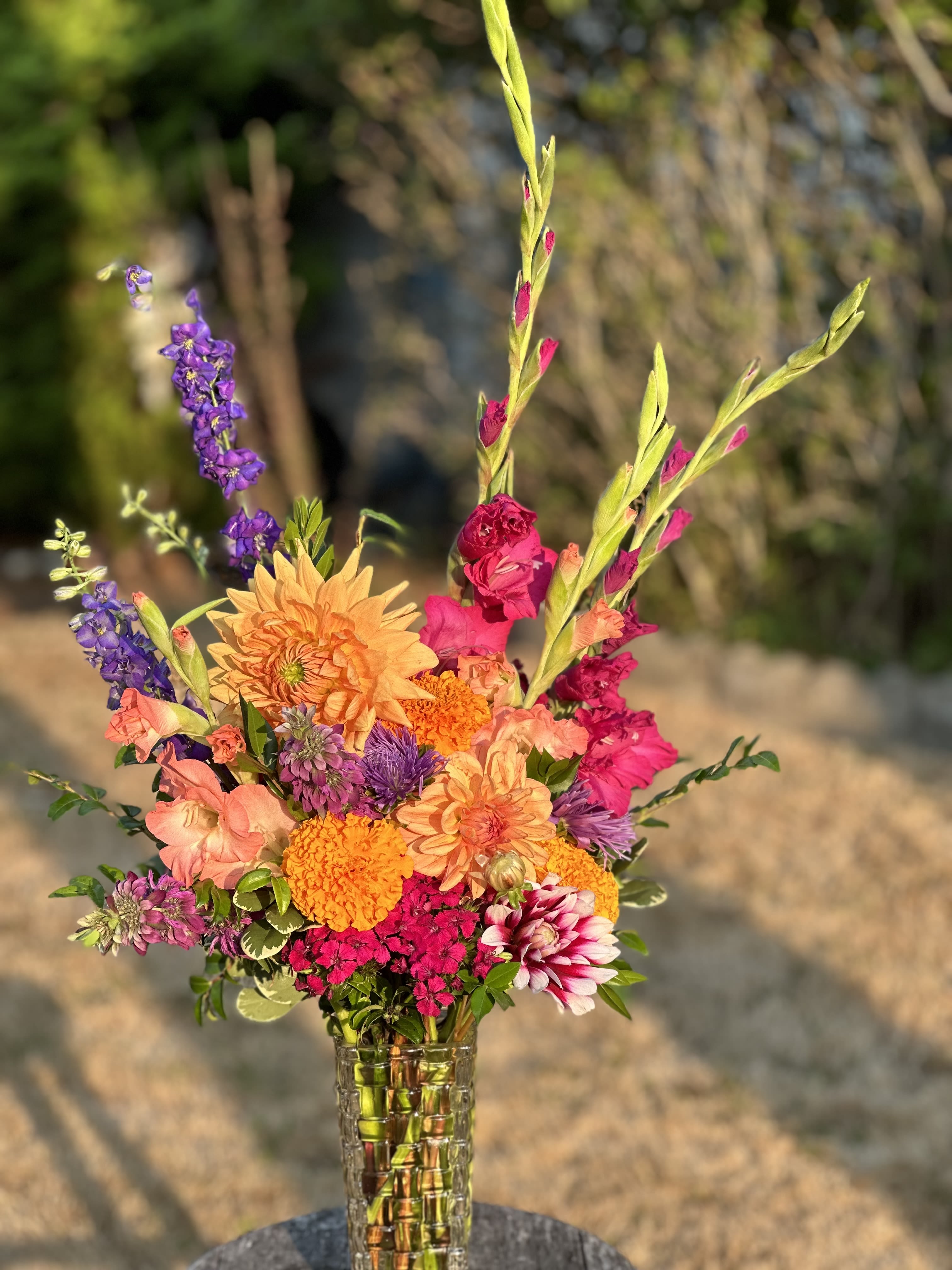Designer's Choice Hand-Tied Bouquet - A Wrapped Bouquet with Seasonal Blooms Wrapped in Recyclable Paper and Tied with Deluxe Ribbon, * Please Note that Flower Choices will vary. We design with only the freshest blooms in the cooler for high impact!