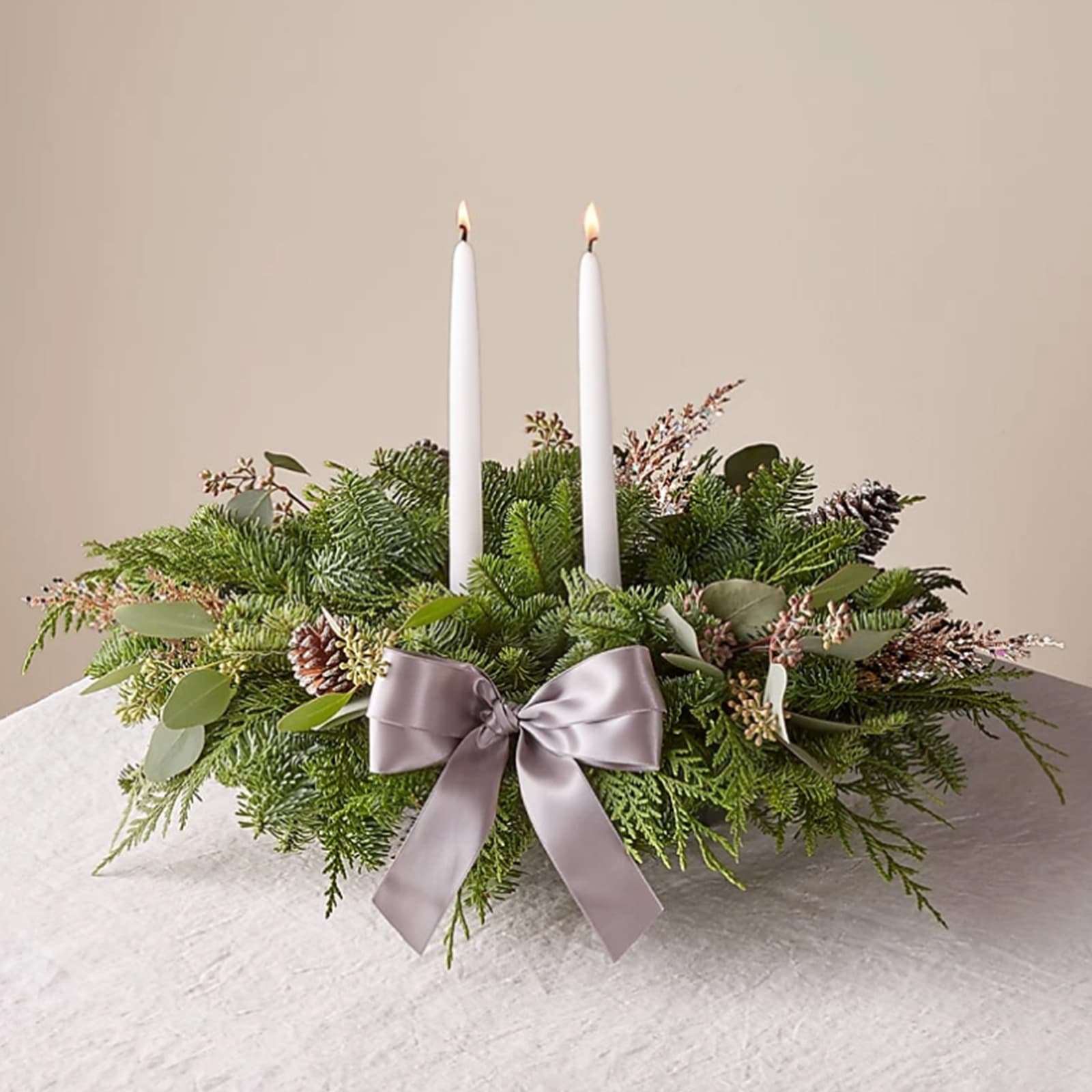Eucalyptus &amp; Pine Centerpiece - Eucalyptus &amp; Pine Centerpiece with Candles, a gorgeous table accent comes with two tall taper candles to complete your décor.  Overall plant height: 11&quot; H with the candle