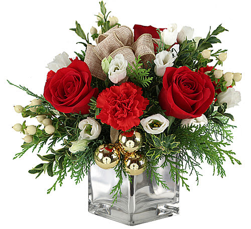 Last Christmas arrangement -  What's Included  (Based on 'standard' version, upgraded and premium may include additional product) Holiday Greens Holiday Greens Rose Rose Lisianthus Lisianthus Carnation Carnation  Brought to you by Canada Flowers Send them some classic Christmas flair with our Last Christmas floral arrangement! Red roses and carnations with other complimenting flowers and decor are presented beautifully in a silver festive container!