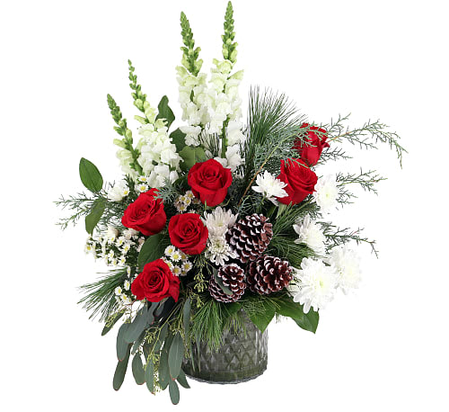 Making Spirits Bright -  Deck the halls (and their holiday home) with a bouquet that shares the most beautiful season’s greetings. Classic red roses, white mums, snapdragons, and more captures the joy of holiday magic for whoever it’s given to.