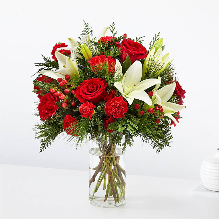 Joyful Greetings Bouquet - Spread cheer to your loved ones near or far with the Joyful Greetings Bouquet, full of cozy red and white blooms perfectly capturing the holiday spirit.