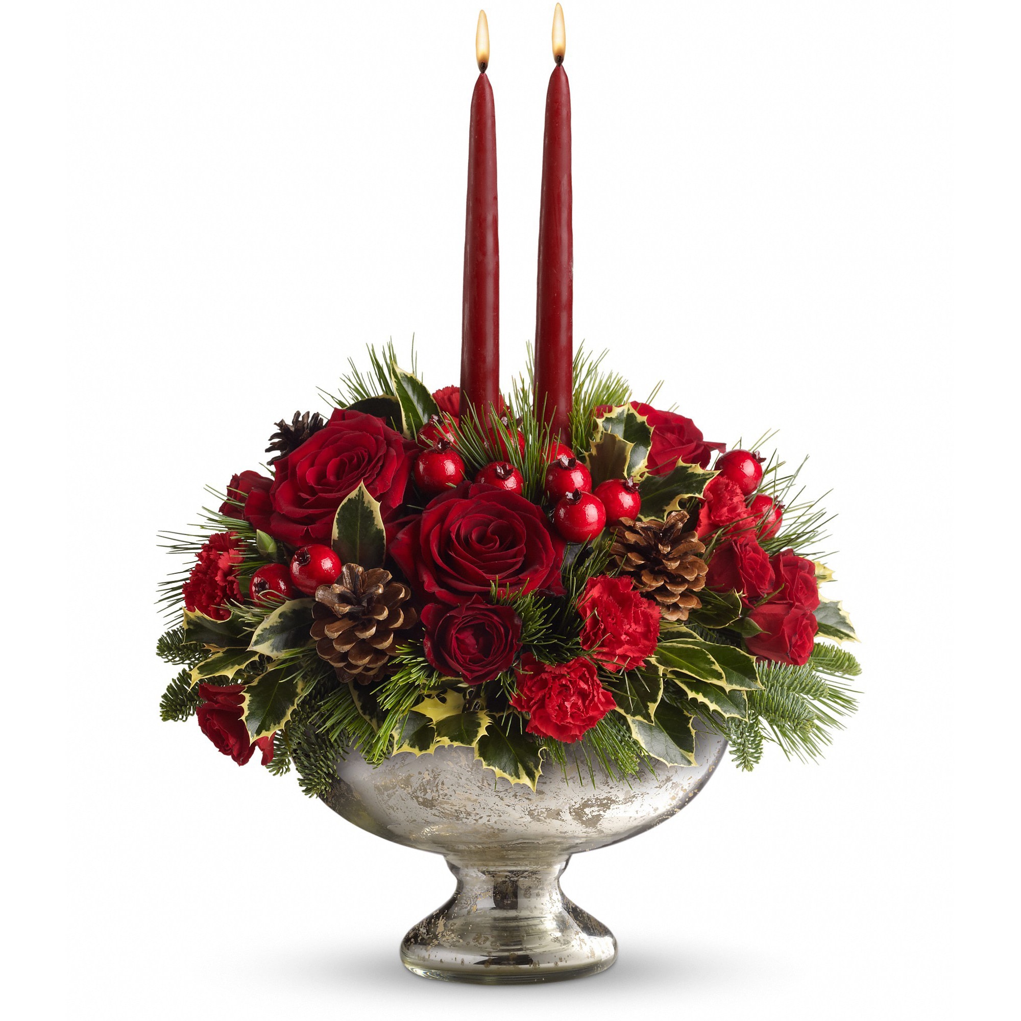 Teleflora's Mercury Glass Bowl Bouquet - Invited to a holiday gathering? Help set the mood and the table by sending this festive holiday centerpiece a day or two before the event. Your hosts will be impressed and incredibly grateful. Plus, they'll be able to use the stunning mercury glass bowl for years to come.  Beautiful red roses, spray roses, carnations and berries are arranged with pine and fir branches, pinecones and holly. Two elegant taper candles complete this perfect arrangement.  Approximately 14&quot; W x 16 1/2&quot; H  Orientation: All-Around  As Shown : T112-1A Deluxe : T112-1B Premium : T112-1C