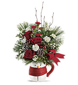 Send a Hug Festive Friend Bouquet by Teleflora - Cozy up to Christmas with this jolly bouquet of winter greens and holiday blooms, hand-delivered in a smiling ceramic snowman mug for years of cocoa-sipping pleasure!