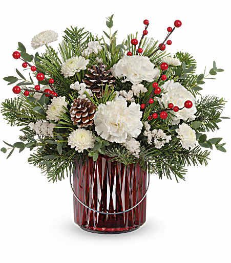 Teleflora's Gleaming Holiday Bouquet - This Christmas bouquet carries your best wishes for a joyful holiday season with vibrant crimson blooms and fresh forest greens. The red lantern vase also serves as a delightful candleholder!
