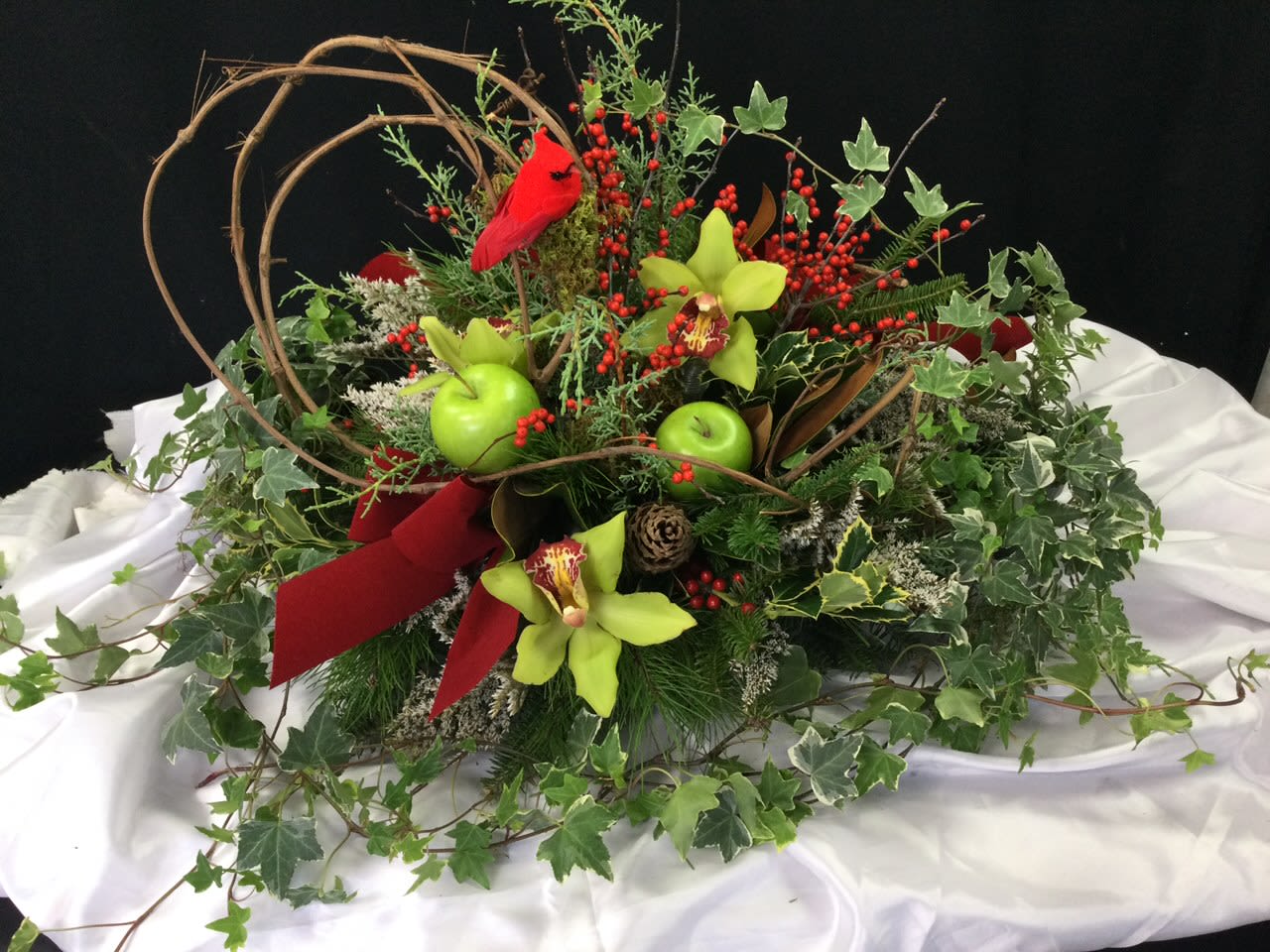 Christmas Centerpiece with Cardinal - This beautiful centerpiece is a must have for this Holiday Season. Send as a gift or use for your own Christmas dinner. The cardinal represents past loved ones, which makes this centerpiece extra special.