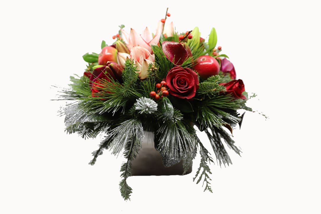 Classic Holiday - Arrangement filled with winter greens, roses, amaryllis, calla lilies, and other beautiful holiday textures 