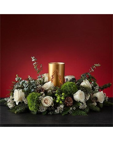 Exquisite Evening Evergreen Centerpiece - Light the way to a silent night snuggled around the Evening Evergreen centerpiece. The festive greenery designed around crisp white roses recreates the calming atmosphere of a winter landscape. Make it a candlelit night by illuminating the tree lantern focal piece.