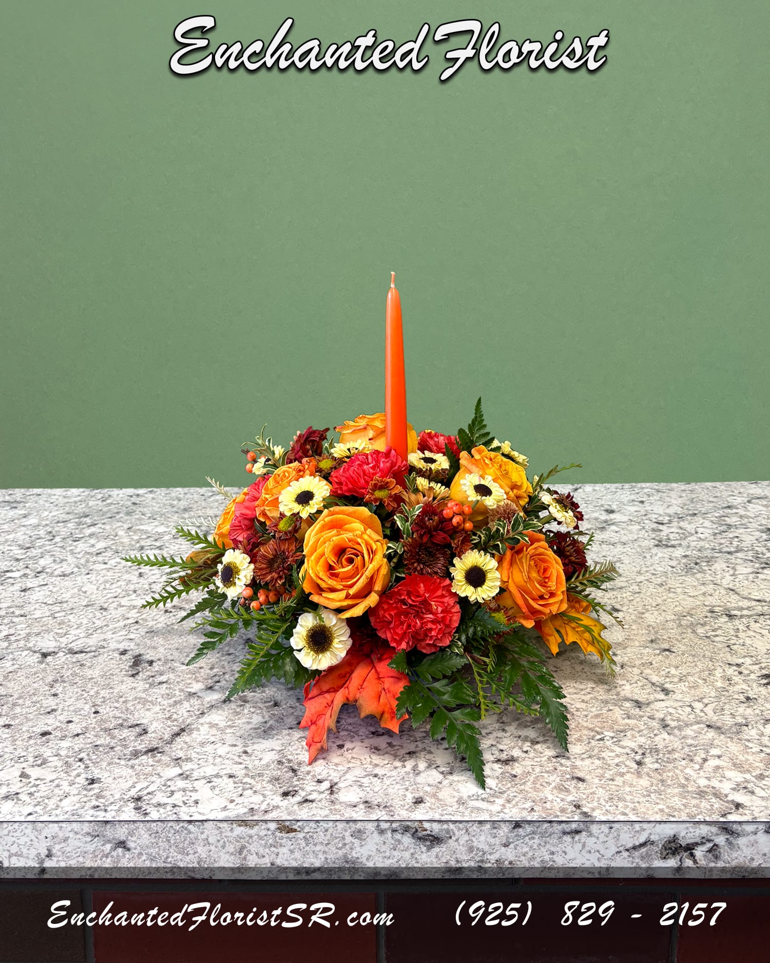 Round Candlelit Harvest - Seasonal Centerpiece - A warm and inviting round seasonal centerpiece. Showcasing an autumnal palette featuring flowers such as roses, carnations, mums, daisy poms, and button mums. Accented with freshly-cut greens such as leather fern, seasonal berries, and grevillea for added texture and depth. An orange tapered candle rises at the center, creating a soft, festive glow perfect for holiday gatherings.  Ideal for brightening the table and adding a touch of seasonal warmth to any home.  Orientation: All-Around  Arrives In: 6&quot; centerpiece dish w/ 1 orange tapered candle  Approximate Dimensions: 12&quot; Tall (including candle) 12&quot; Wide 12&quot; Depth