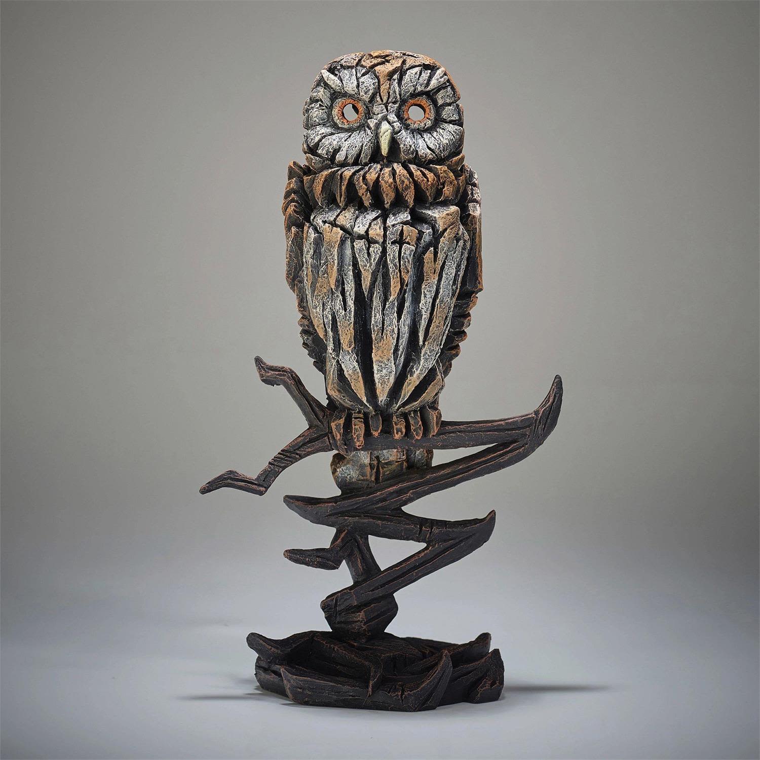 Enchanted Owl of the Four Realms — Edge Sculpture Figurine - Mysterious and majestic, the Enchanted Owl of the Four Realms serves as a silent guardian within the magical world of The Nutcracker and the Four Realms of Christmas. Perched with watchful grace, this wise creature oversees the Realms of Snowflakes, Flowers, Sweets, and Amusements, moving through the night with the quiet elegance of a winter spirit.  This exquisitely crafted Edge Sculpture figurine captures the owl’s enchanting presence in stunning detail. Hand painted in warm browns and soft whites and sculpted from textured stone resin, the piece evokes both the strength and serenity of this symbolic winter guardian. Standing 12.75 inches high and designed exclusively for indoor display, it becomes a striking focal point wherever it is placed.  Let the magic of the Four Realms take flight in your home with this beautifully rendered owl—a timeless emblem of wisdom, wonder, and holiday enchantment.