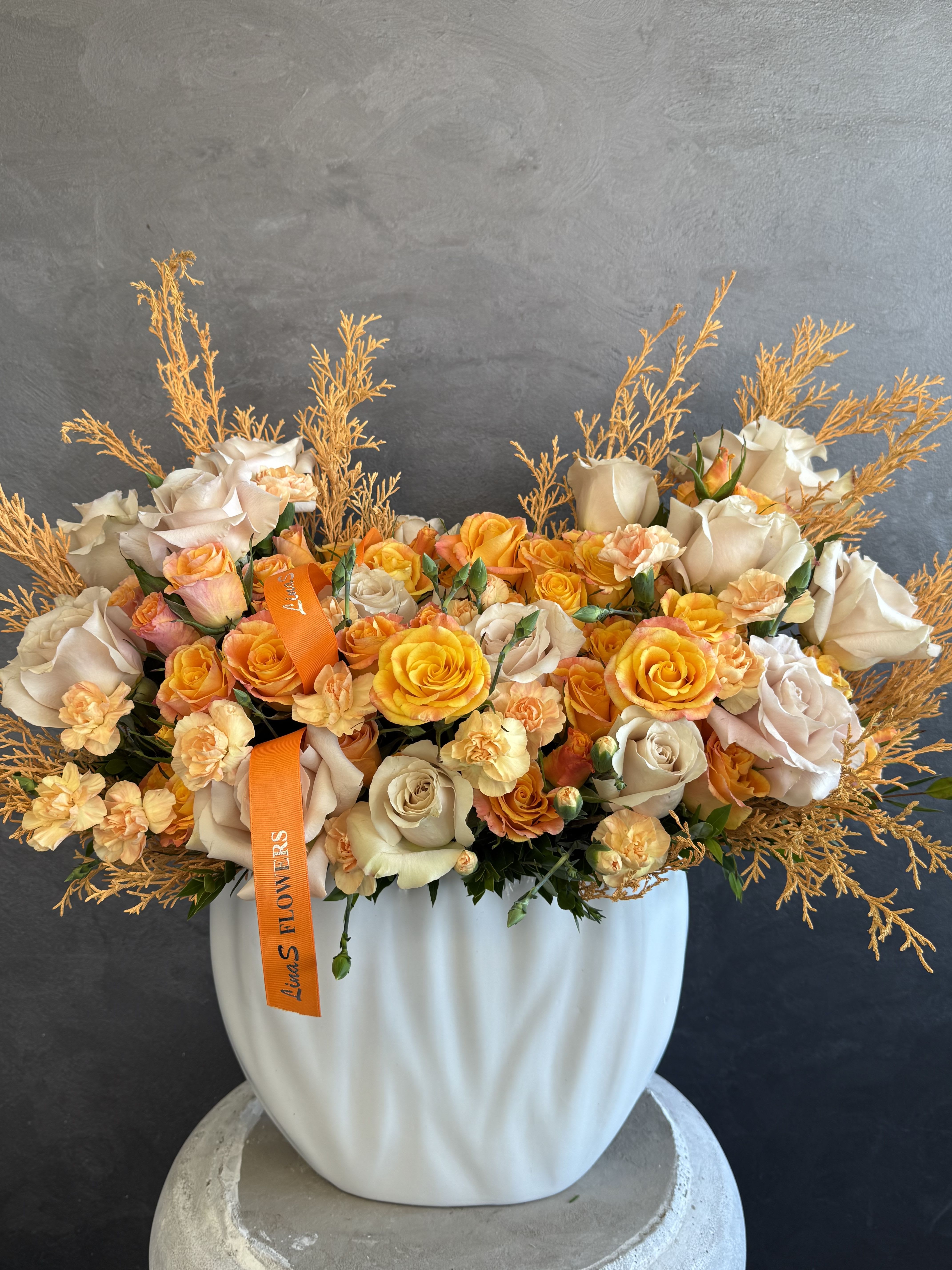Slav - “A vibrant blend of orange, peach, and yellow blooms — warm, sun-kissed shades that bring joy, energy, and soft elegance to any arrangement.”
