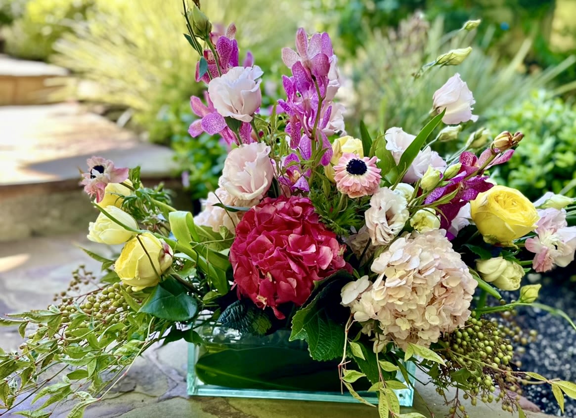 PEARL AND PETAL - A fresh, garden design arrangement full of interesting, beautiful, blooms…  This one may vary with availability but I can sure promise you hydrangeas, roses, peonies and tulips!!