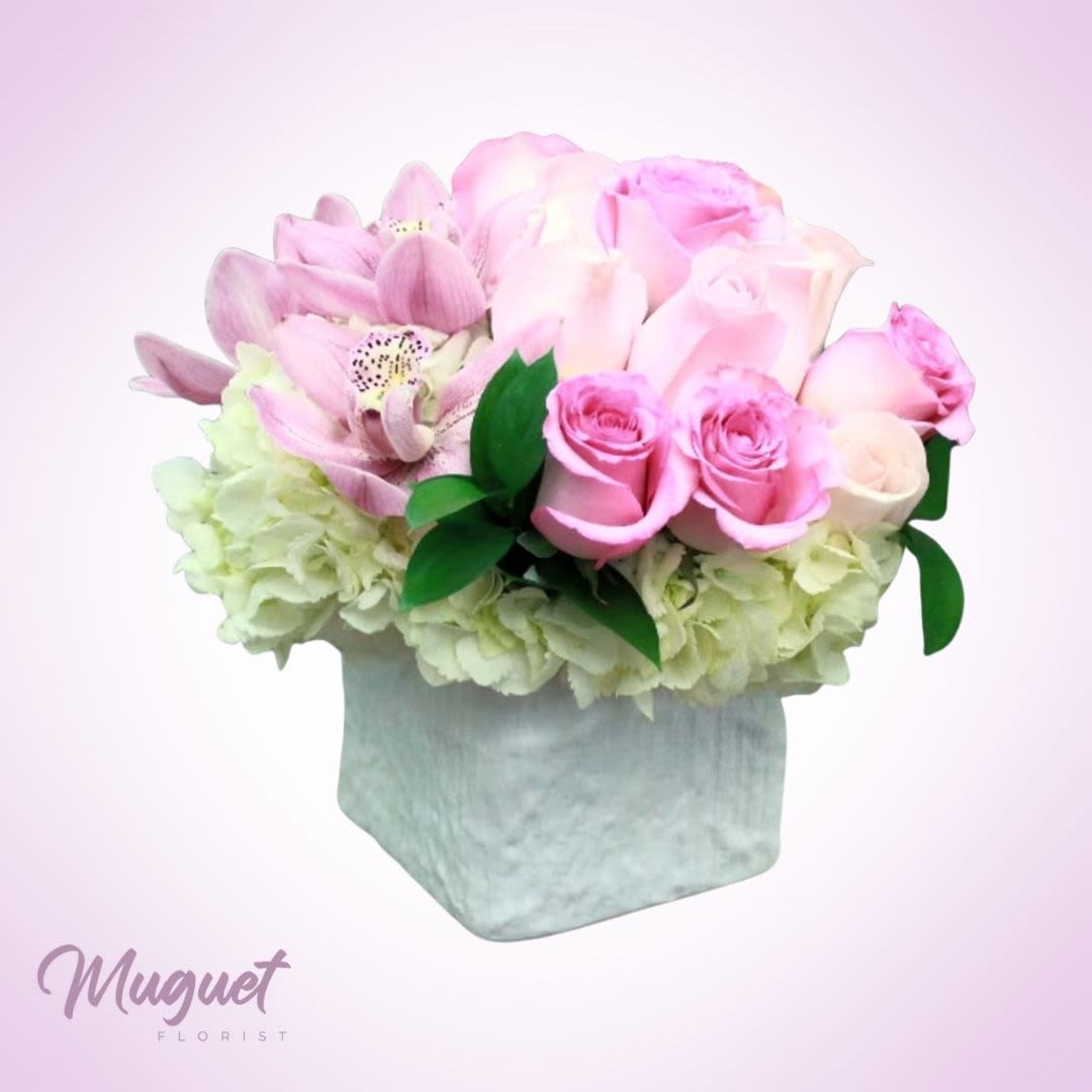 Oh-So Pink Rose Sensation: An Elegance of Blushing Beauty - Indulge in the romantic allure of the &quot;Oh-So Pink Rose Sensation&quot; arrangement, a captivating ensemble that celebrates the irresistible charm of pink roses. This arrangement is a symphony of blushing beauty, combining a variety of pink rose varieties to create an exquisite tapestry of elegance. Its soft hues and delicate blooms embody the essence of romance and grace.  &quot;Varieties and colors of flowers may vary according to season and availability.&quot;  This arrangement includes a newly cleaned vase and good quality water &amp; flower food.  Item: 114  Care Instructions: For the best vase life, change the water every two days.