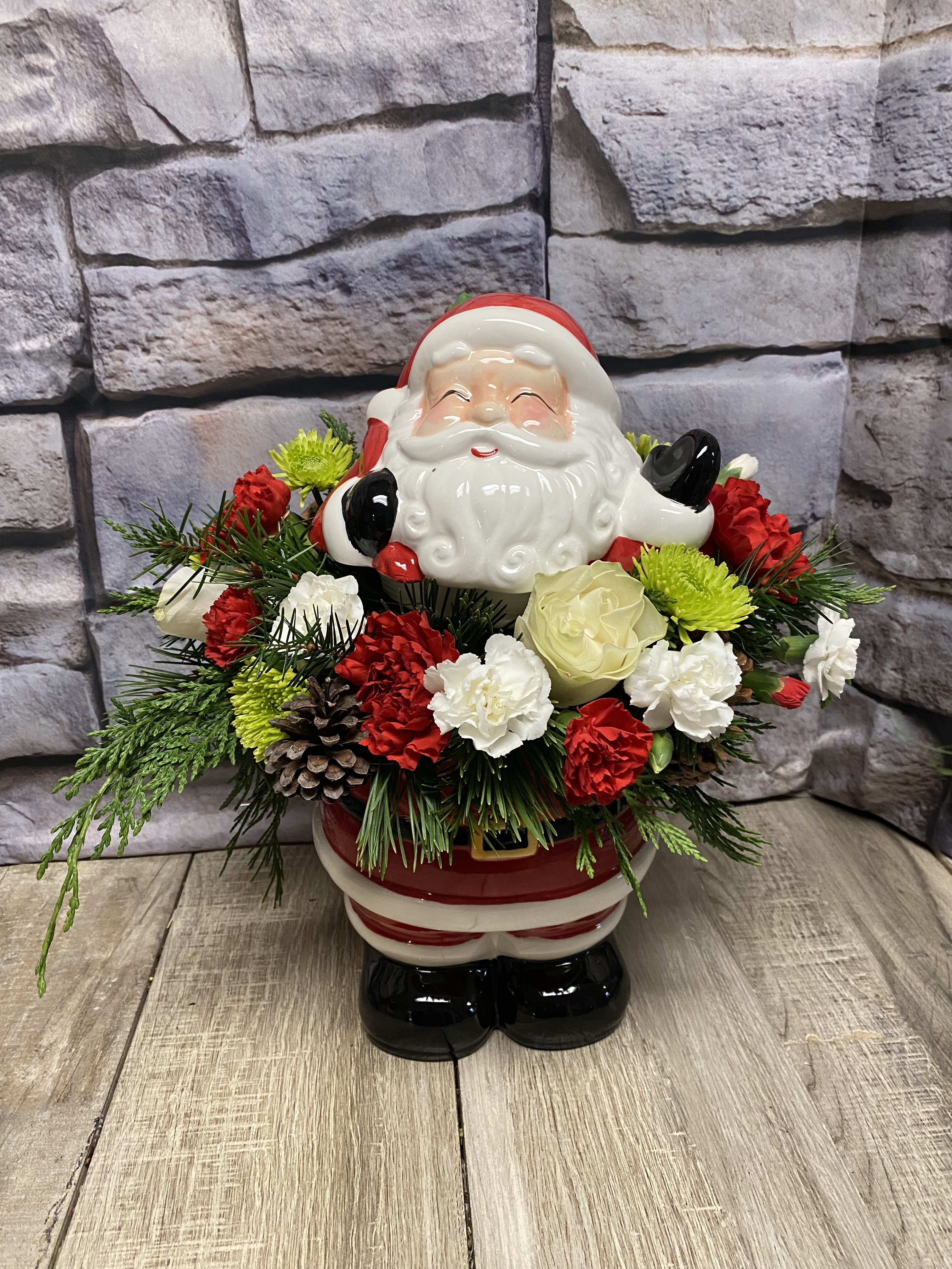 Santa Cookie Jar - This Santa cookie jar will have heads turning, it has a stunning floral arrangement in it, then once the florals are gone you have a keepsake cookie jar. Send this to your loved ones this holiday season.