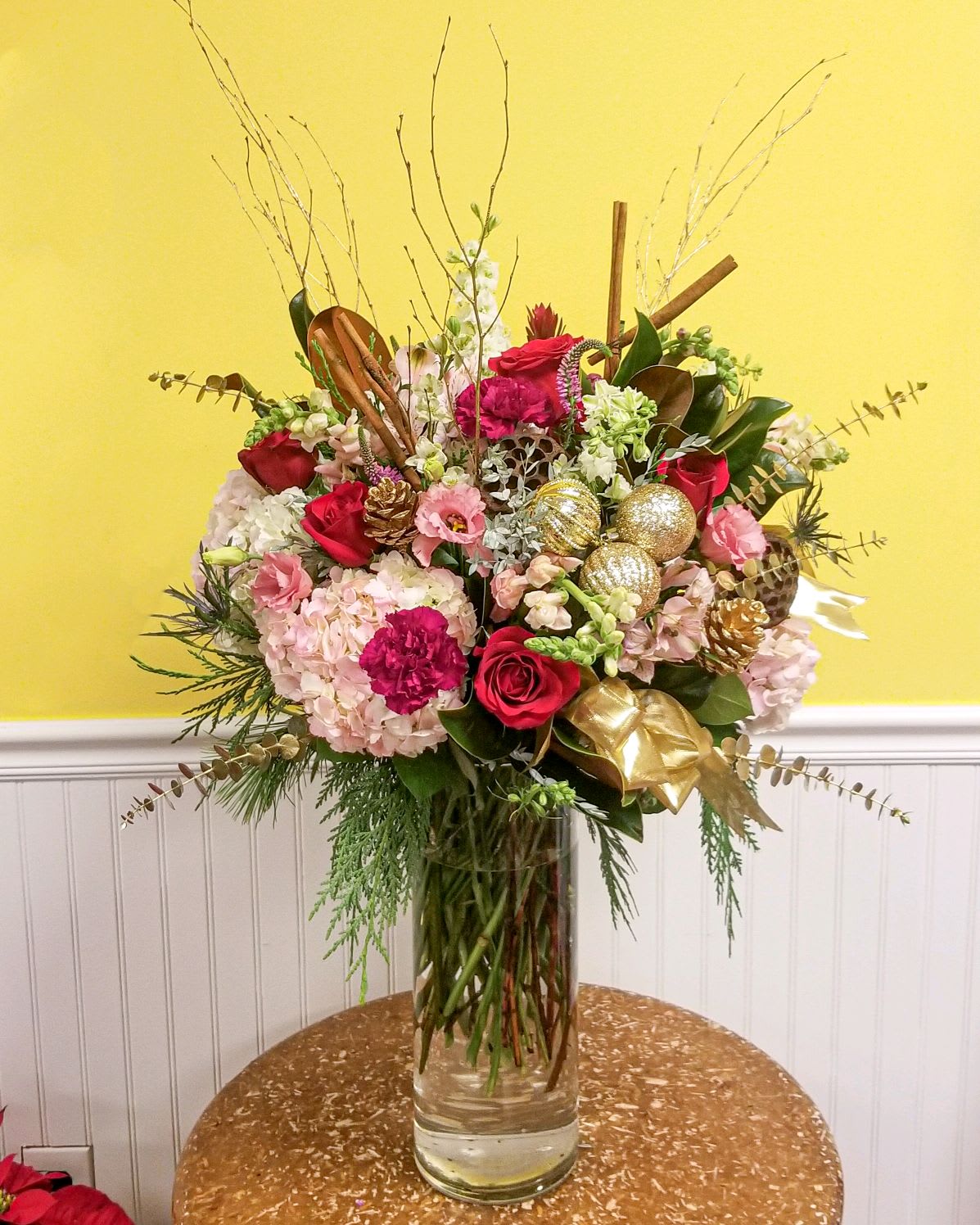 Dance of the Sugar Plum Luxury bouquet - The Dance of the Sugar Plum Luxury Bouquet is surely to impress!  This jaw dropping arrangement is in a tall clear glass cylinder filled with top of the line blooms and designed by the most professional of designers.  