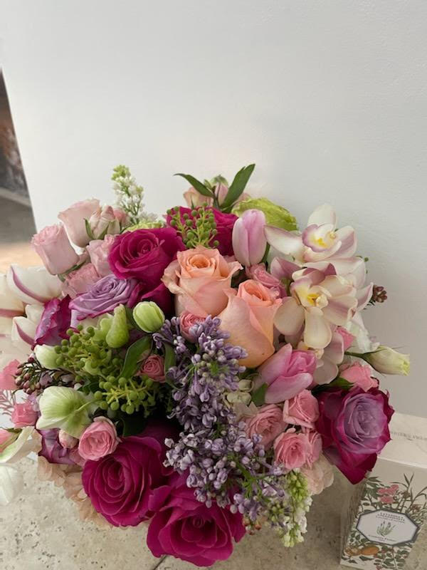 The Scent of a Beautiful Day Bouquet: Capturing Nature's Aromas - A beautiful day is often accompanied by the delightful scents of blooming flowers, a fragrance that lingers in the air and fills our senses with joy. The &quot;Scent of a Beautiful Day Bouquet&quot; captures this essence in a collection of blooms that exude nature's aromas. Join us as we explore the petals of this bouquet, where each flower becomes a vessel of the scents that make a day truly beautiful.  Please call the shop for color options and availability.  Varieties and colors of flowers and planters may vary according to season and availability. This arrangement includes a newly cleaned vase and good quality water &amp; flower food.  Item: 414  Care Instructions: For the best vase life, change the water every two days.