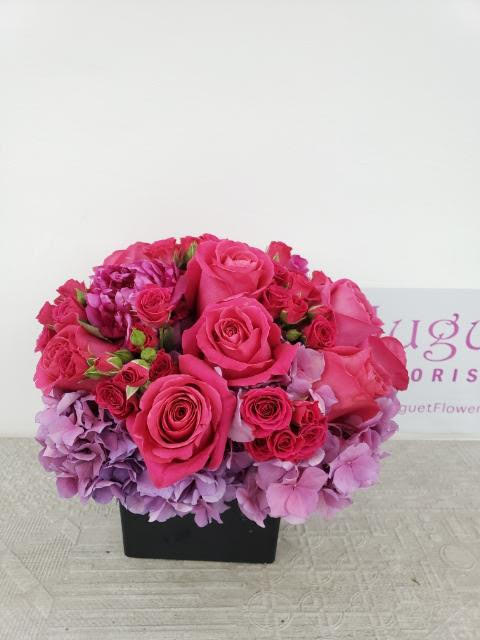 Whispers of Pink: A Cloud of Delicate Beauty in Floral Arrangement - Experience the ethereal beauty of a cloud adorned in delicate shades of pink with the &quot;Whispers of Pink Flower Arrangement.&quot; This arrangement captures the gentle essence of floating petals and the subtle charm of pink hues. Like a cloud that brings a sense of calm and serenity, this floral masterpiece envelops you in a world of soft elegance and natural beauty.  This arrangement includes a newly cleaned vase and good quality water &amp; flower food.  Item: 187  Care Instructions: For the best vase life, change the water every two days.  Varieties and colors of flowers may vary according to season and availability.