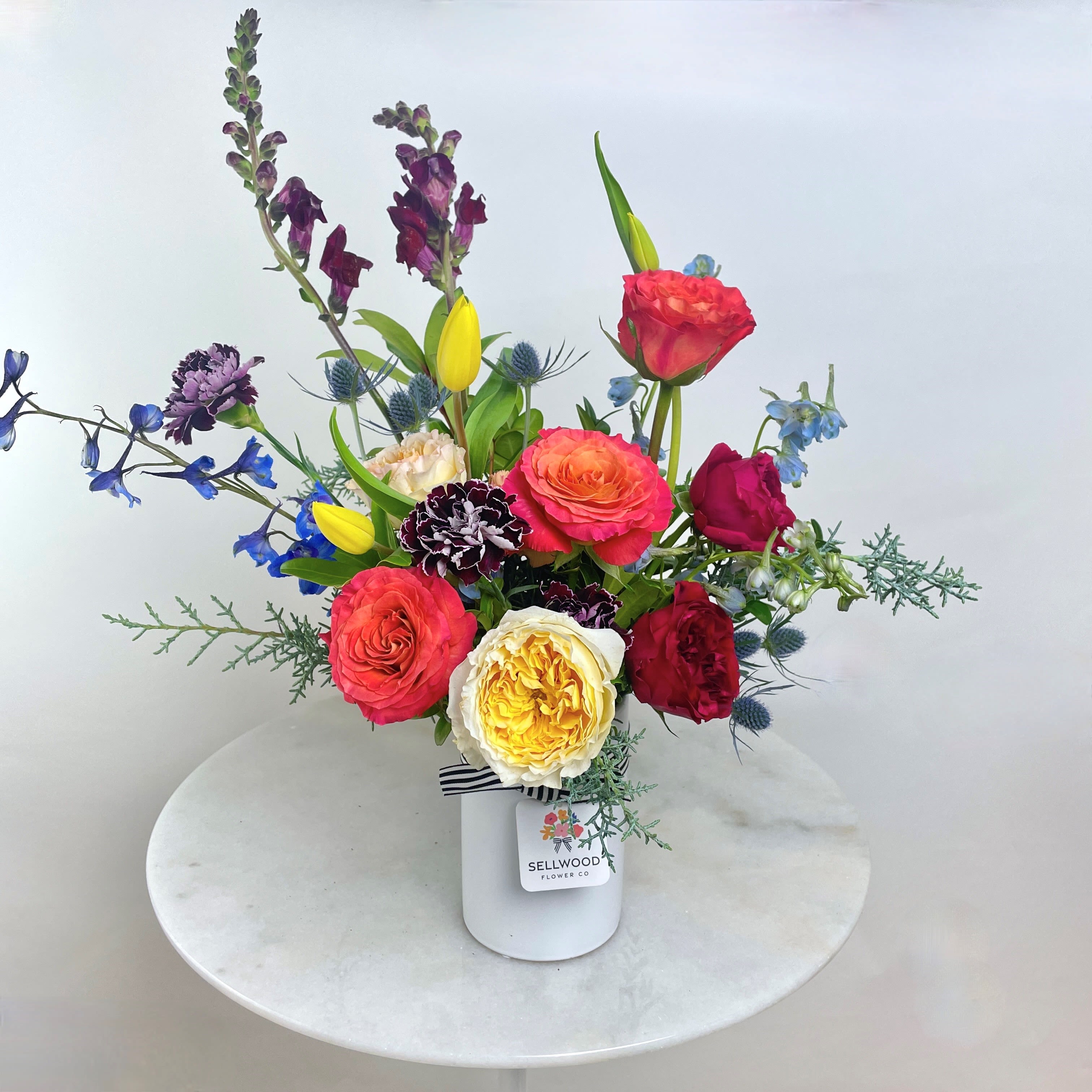 The Winter Garden - This arrangement bursts with vibrant, rainbow-hued flowers, symbolizing love, diversity, and inclusivity. Each bloom is thoughtfully chosen to brighten up your recipient's space and day!