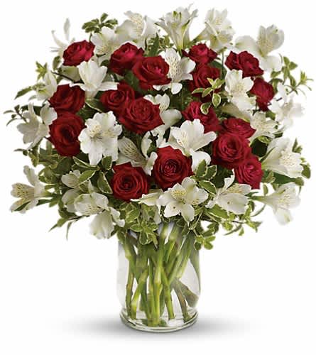 Endless Romance Bouquet - Endless roses endless romance! Make a statement with our stunning bouquet of red roses with snowy white blossoms delivered in a glass hurricane vase that will forever remind her of your love. Includes red spray roses white alstroemeria and pretty pitta negra. Delivered in a glass hurricane vase.