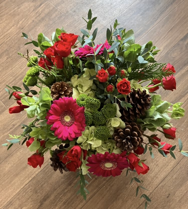 Holiday Hoopla - Mixed seasonal flowers, with cones, hydrangeas and winter greenery.